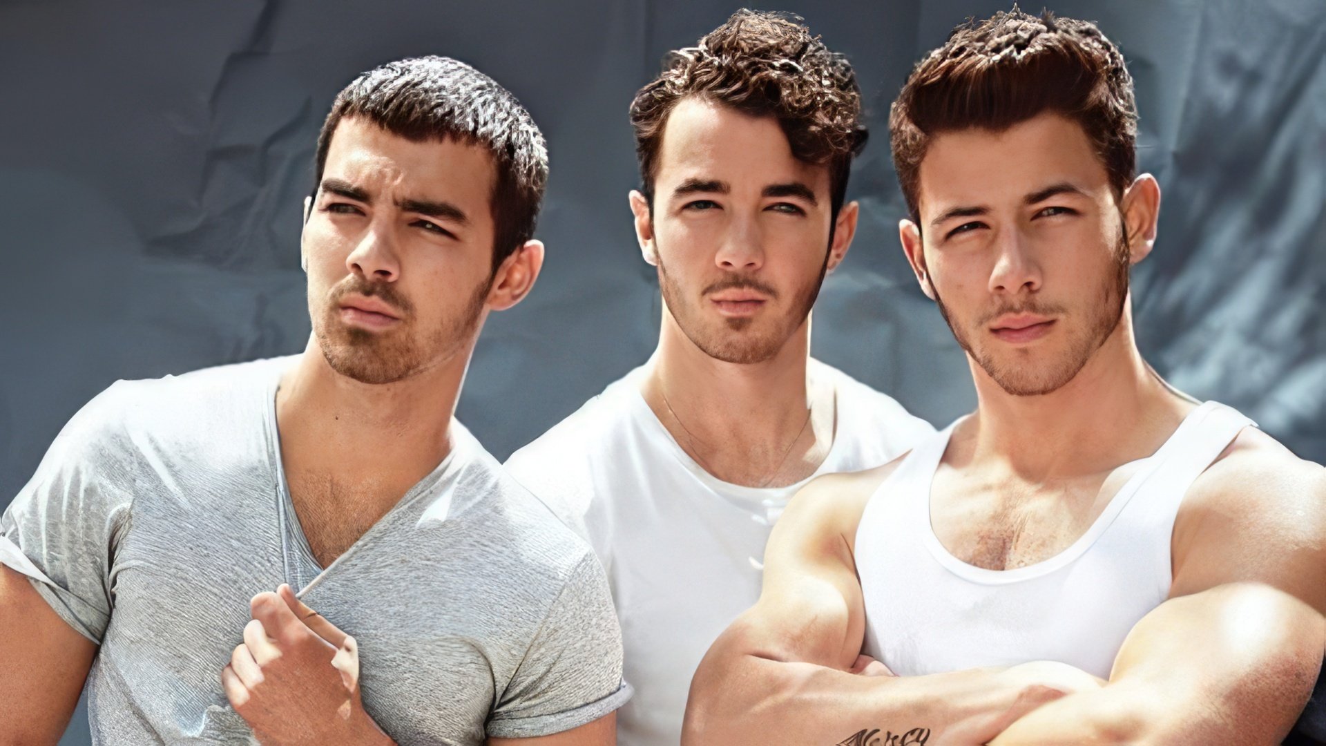Nick Jonas and his brothers as the Jonas Brothers band