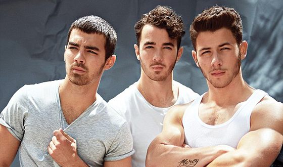 Nick Jonas and his brothers as the Jonas Brothers band