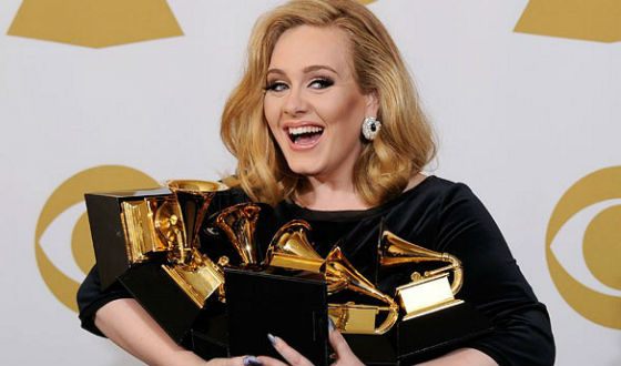 Adele beats records of 