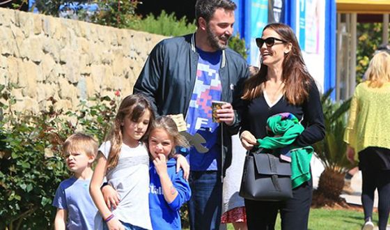 Ben and Jennifer walking with their children