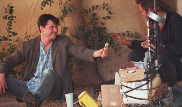 Young Keanu interacting with a homeless man