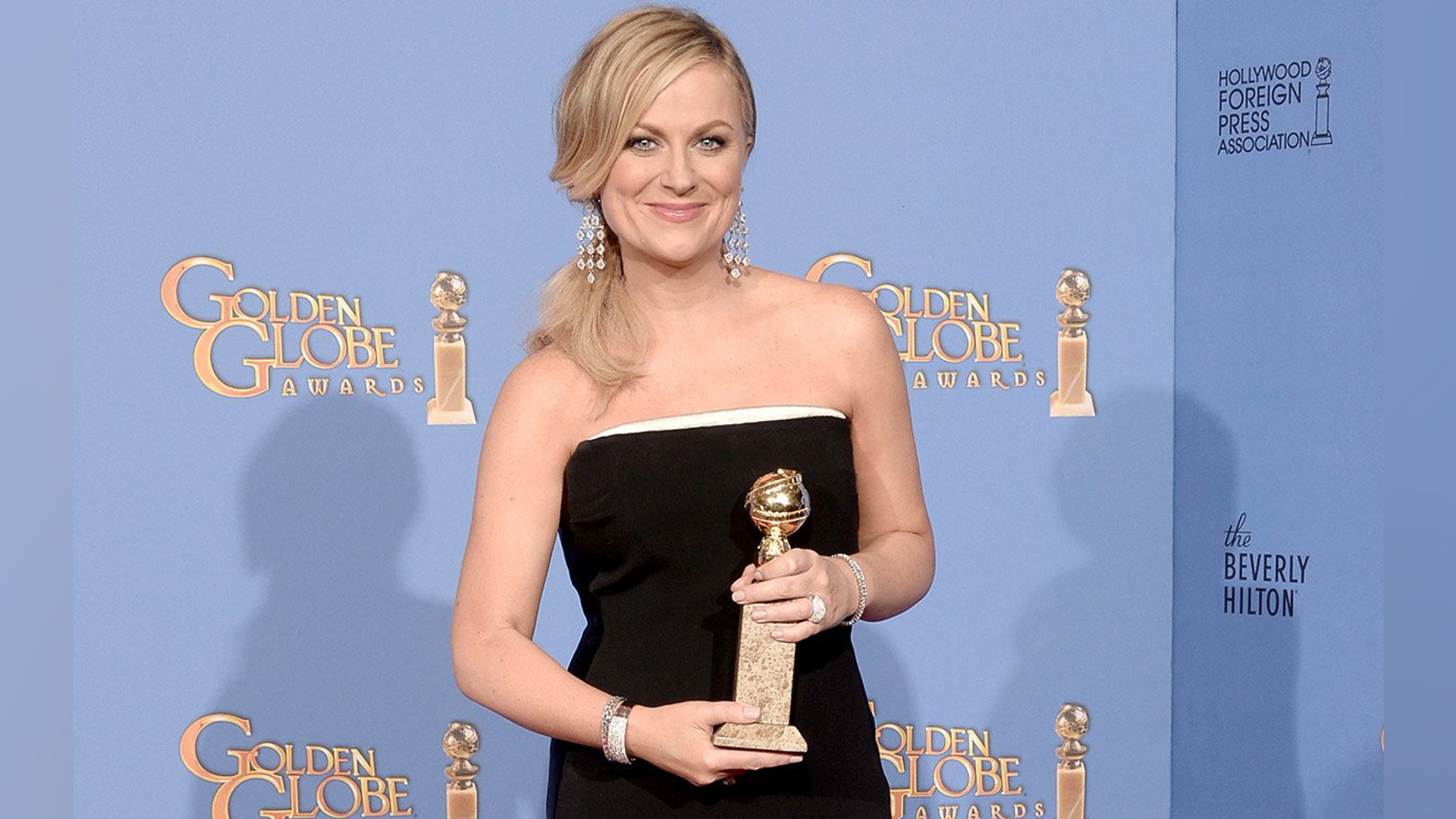 Amy Poehler with a Golden Globe