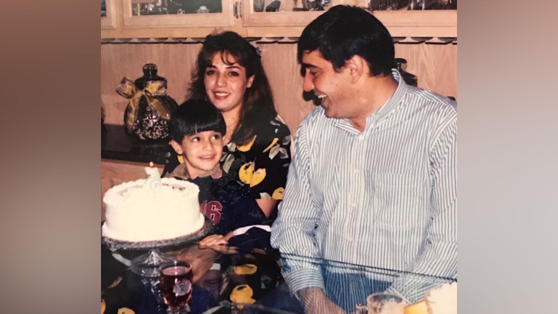 Sam Asghari as a child with his parents