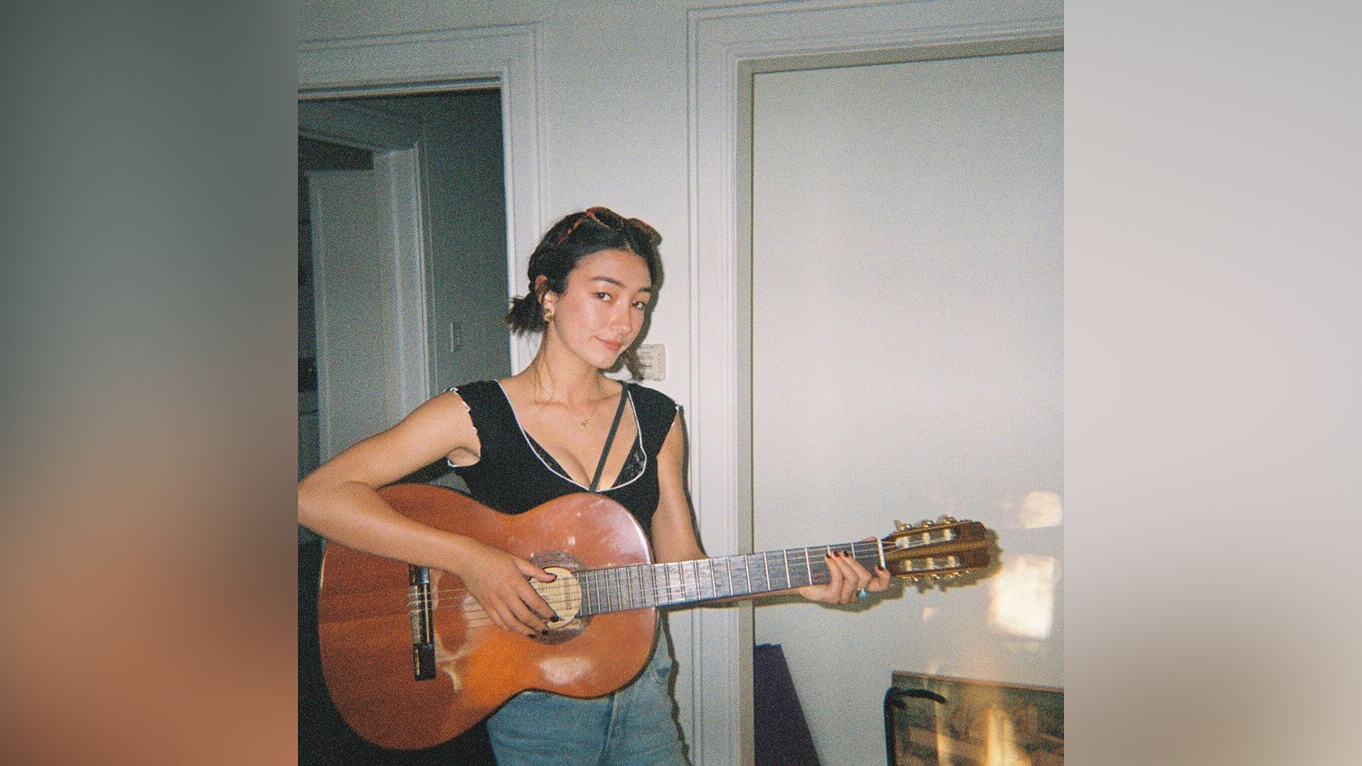 Natasha Liu Bordizzo playing guitar