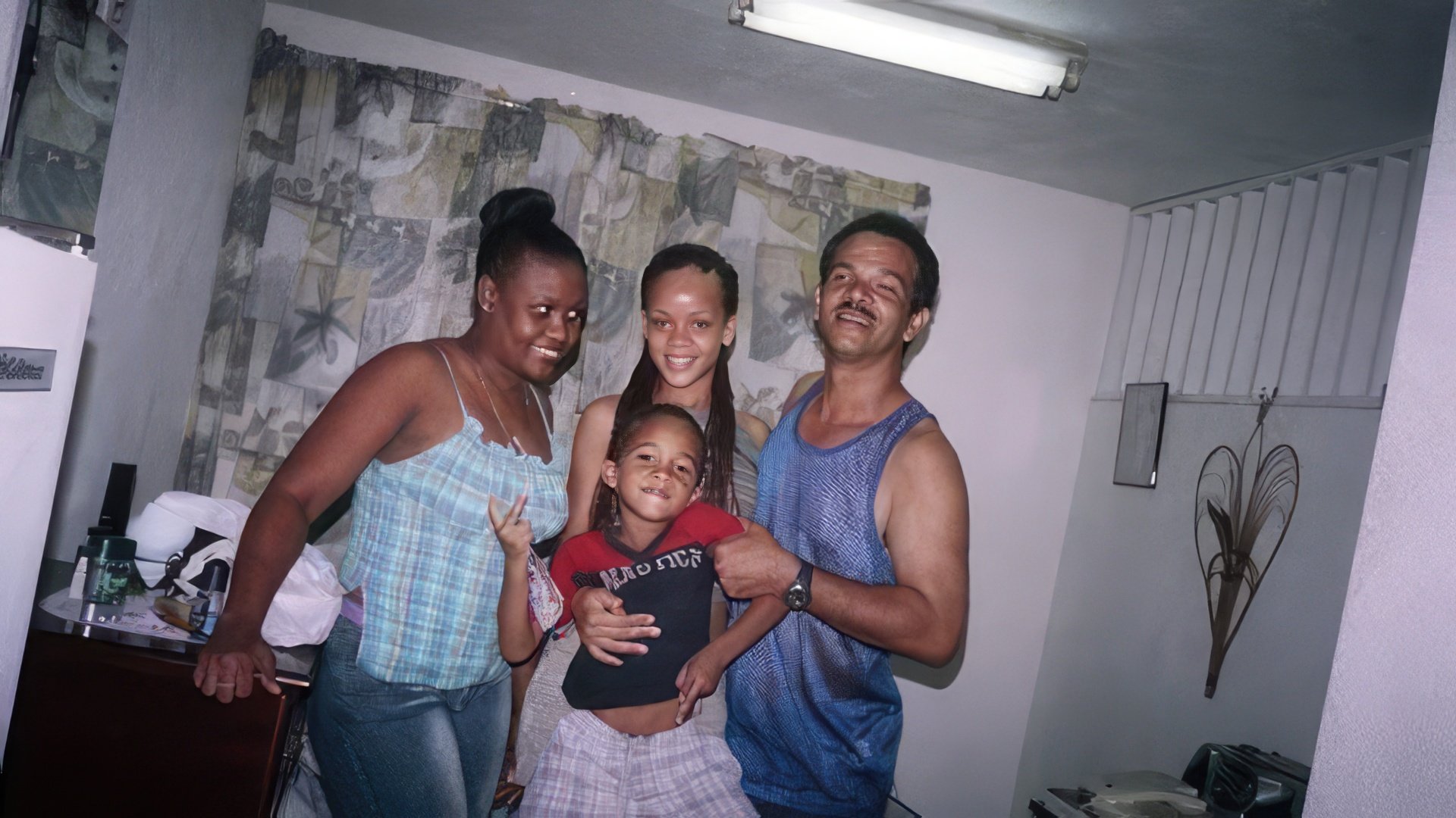 Young Rihanna with her parents and younger brother