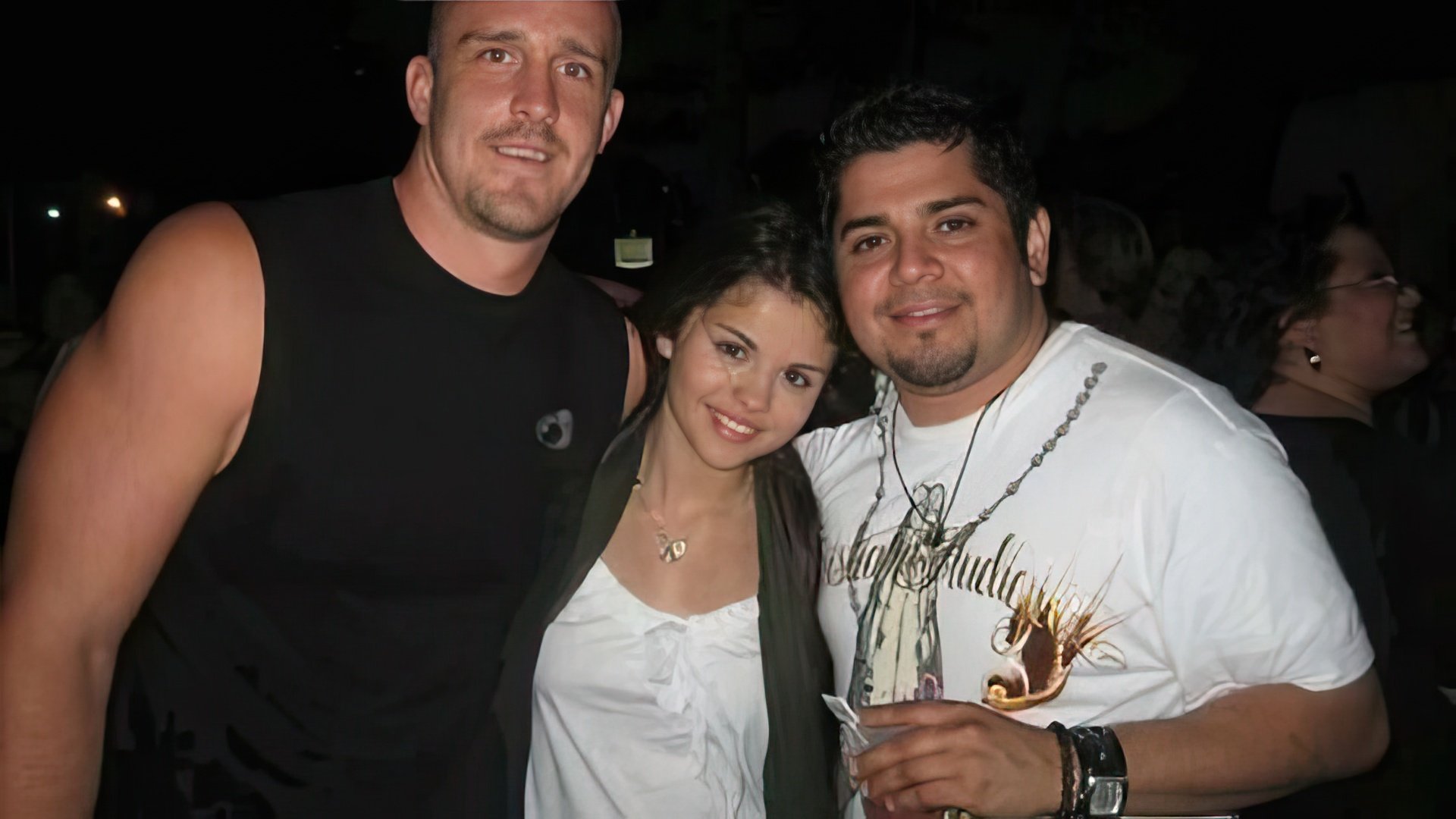 Selena Gomez with her father (right) and stepfather (left)