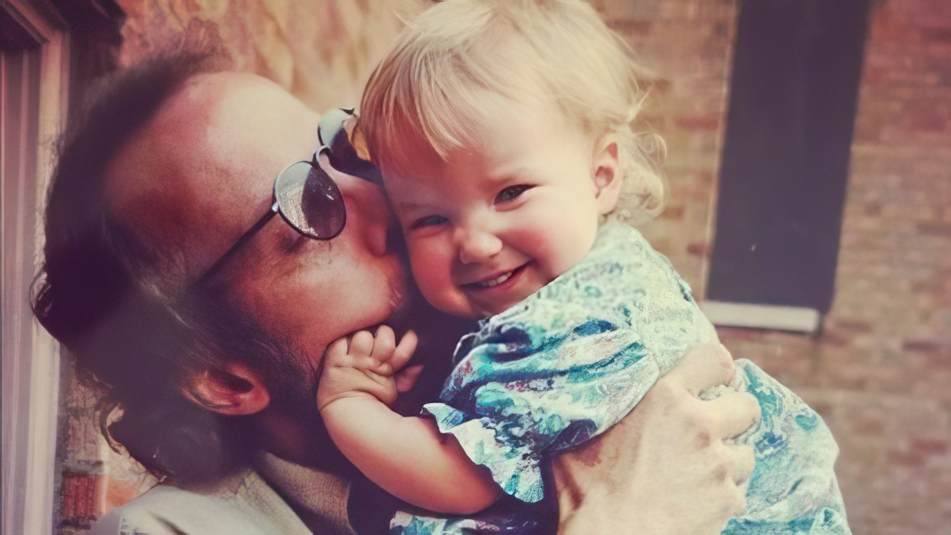 Dove Cameron as a child with her father