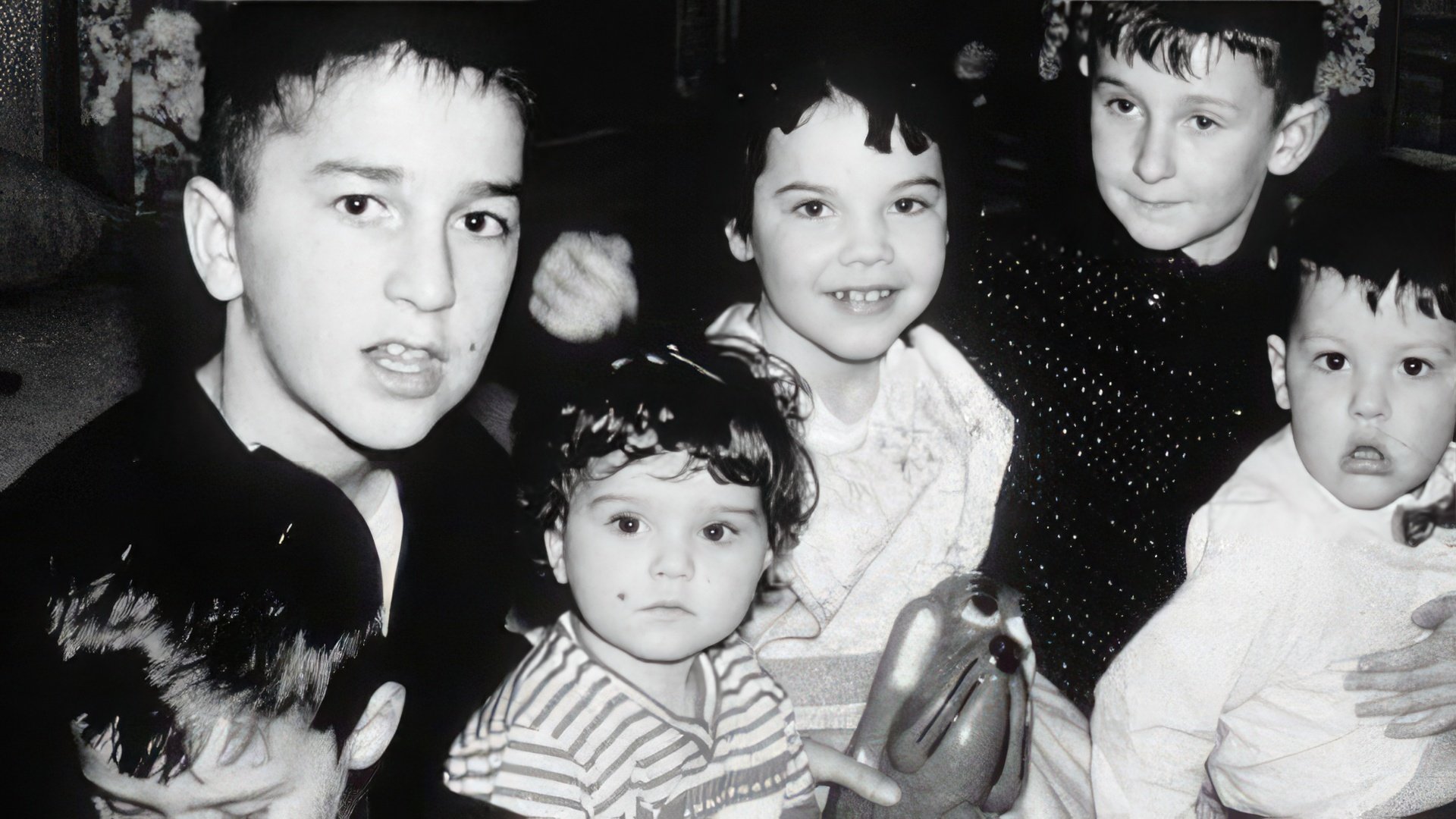 Madonna (center) with her brothers and sister