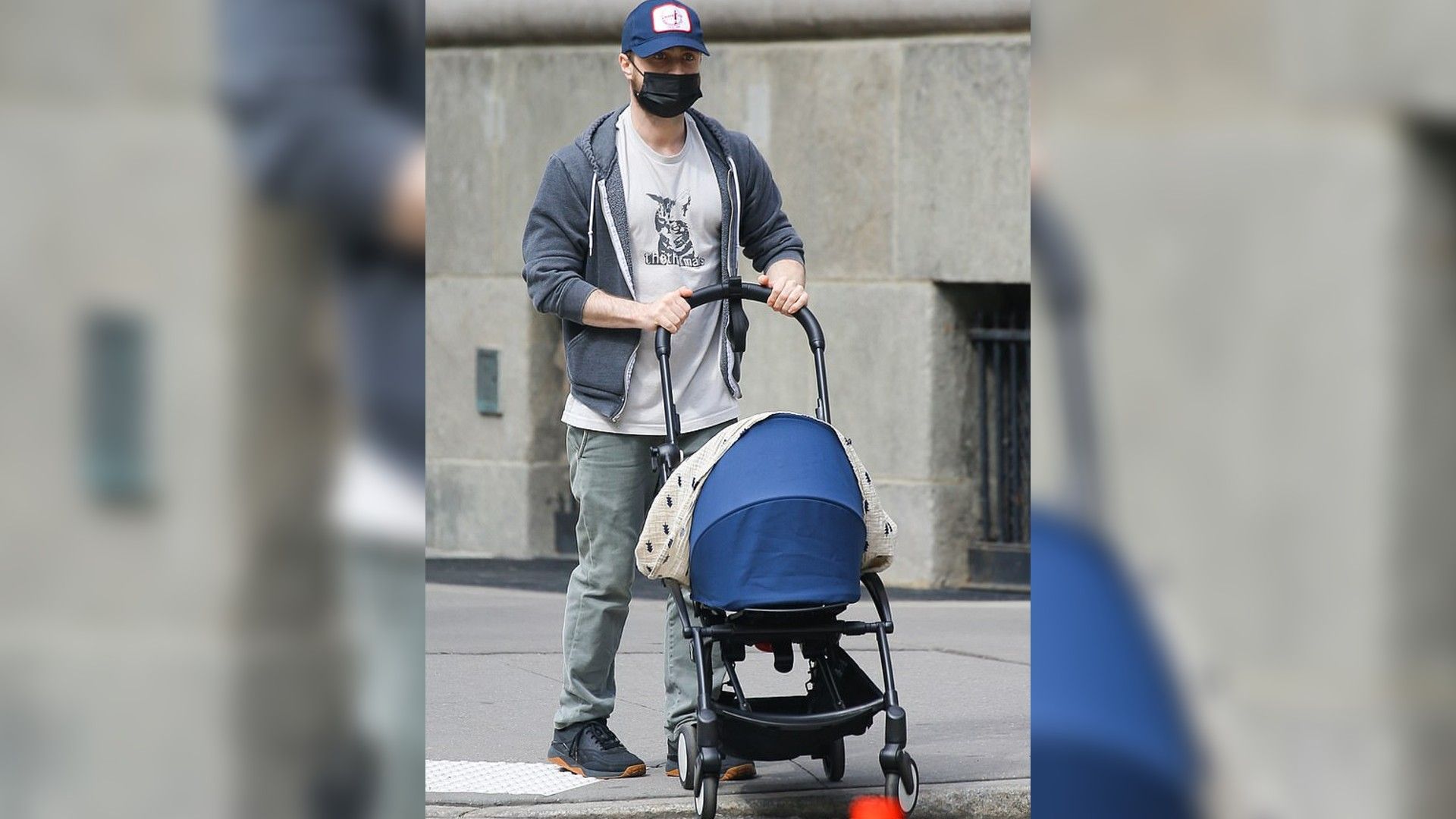 Daniel Radcliffe walking with his newborn baby
