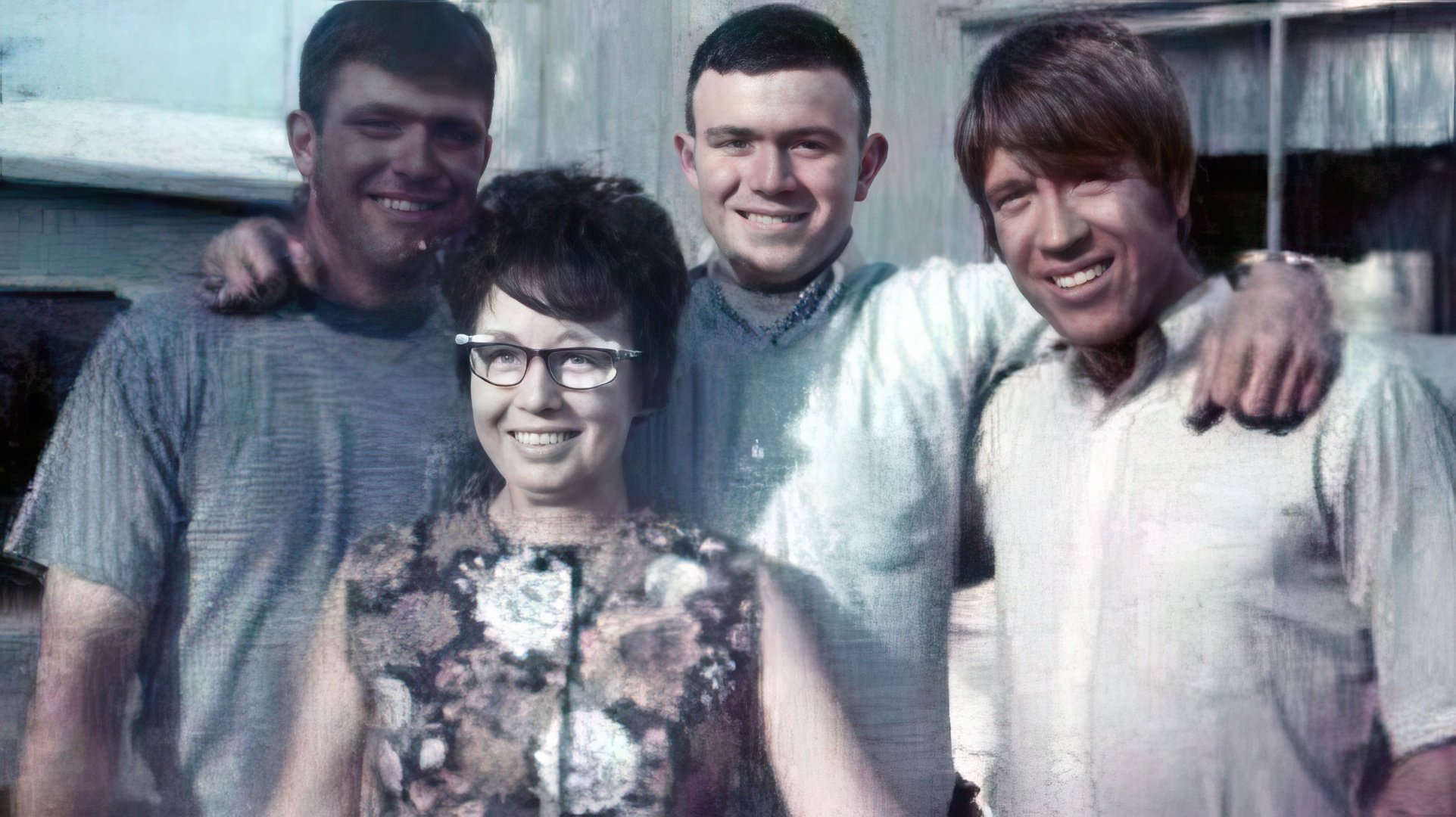 Chuck Norris with his mother and younger brothers