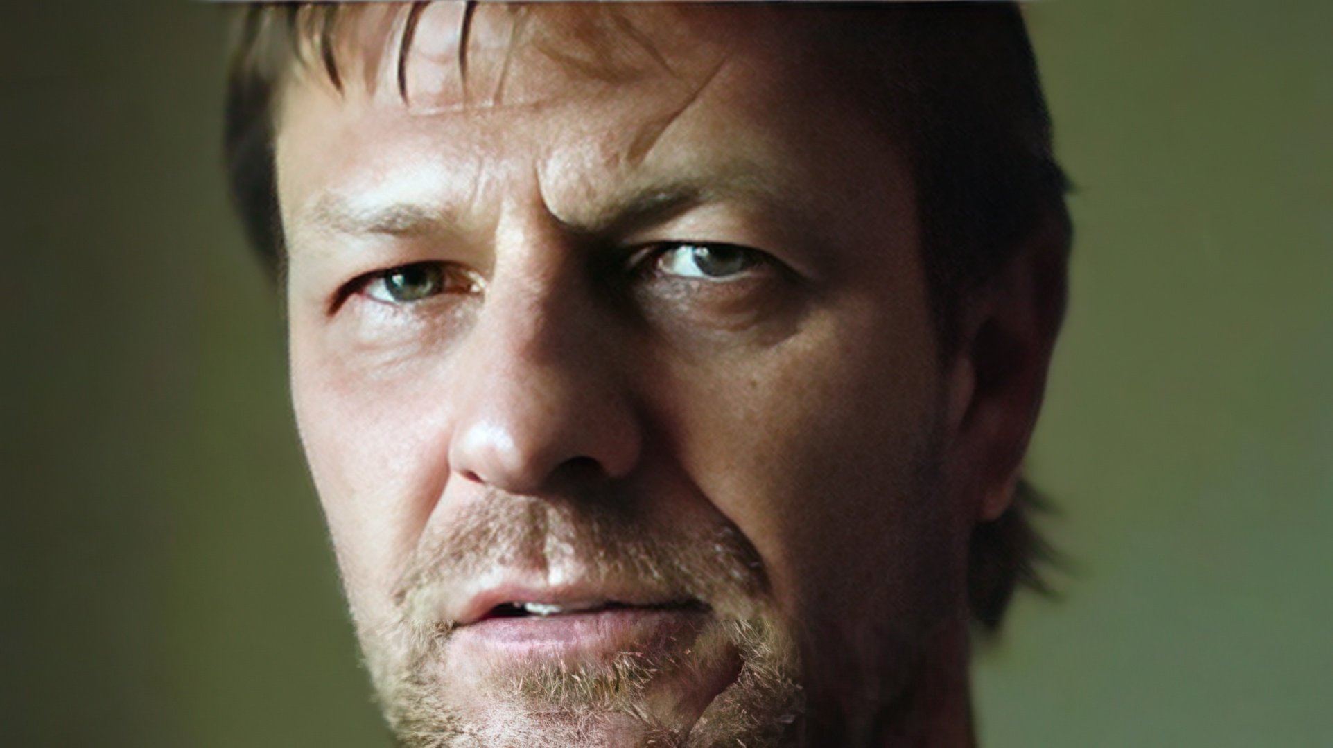 A scar is visible above the actor's left eye