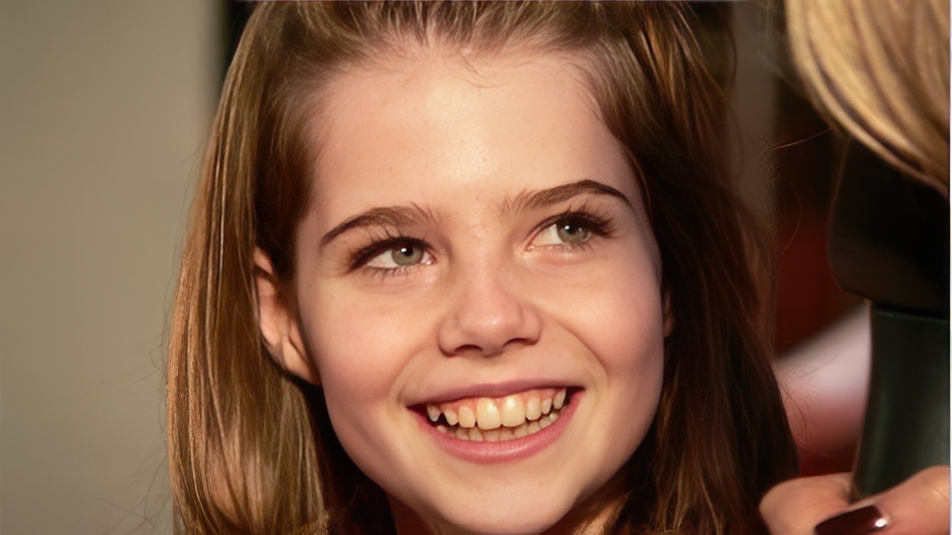 Lucy Boynton as a child