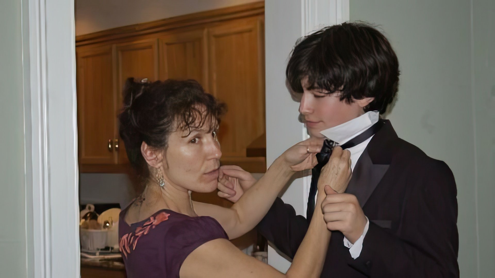 The photo shows young Ezra Miller and his mother