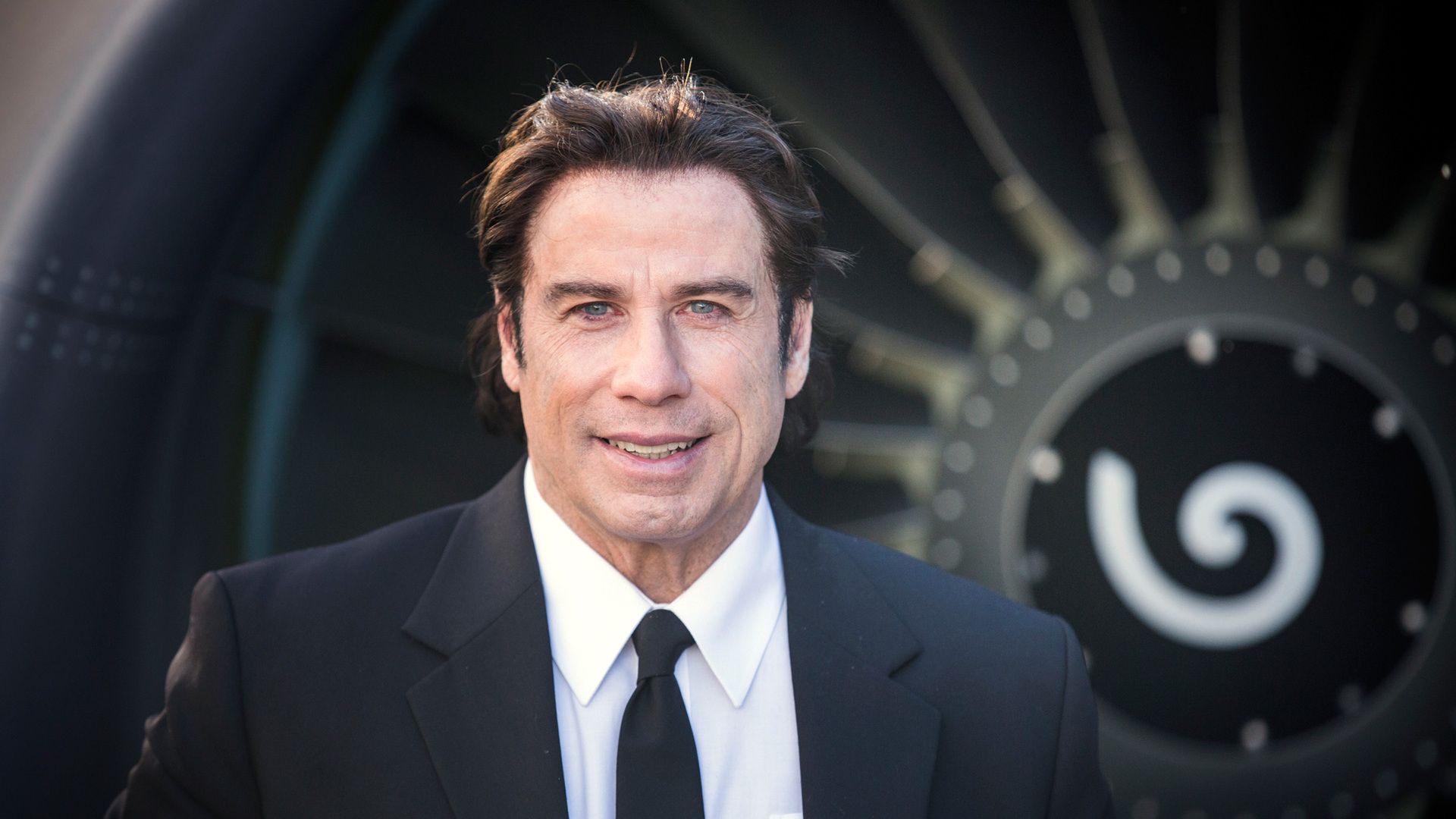 John Travolta is an Aquarius by zodiac sign