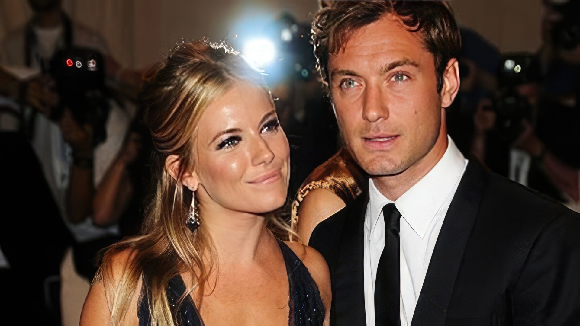 On the photo: Jude Law and Sienna Miller
