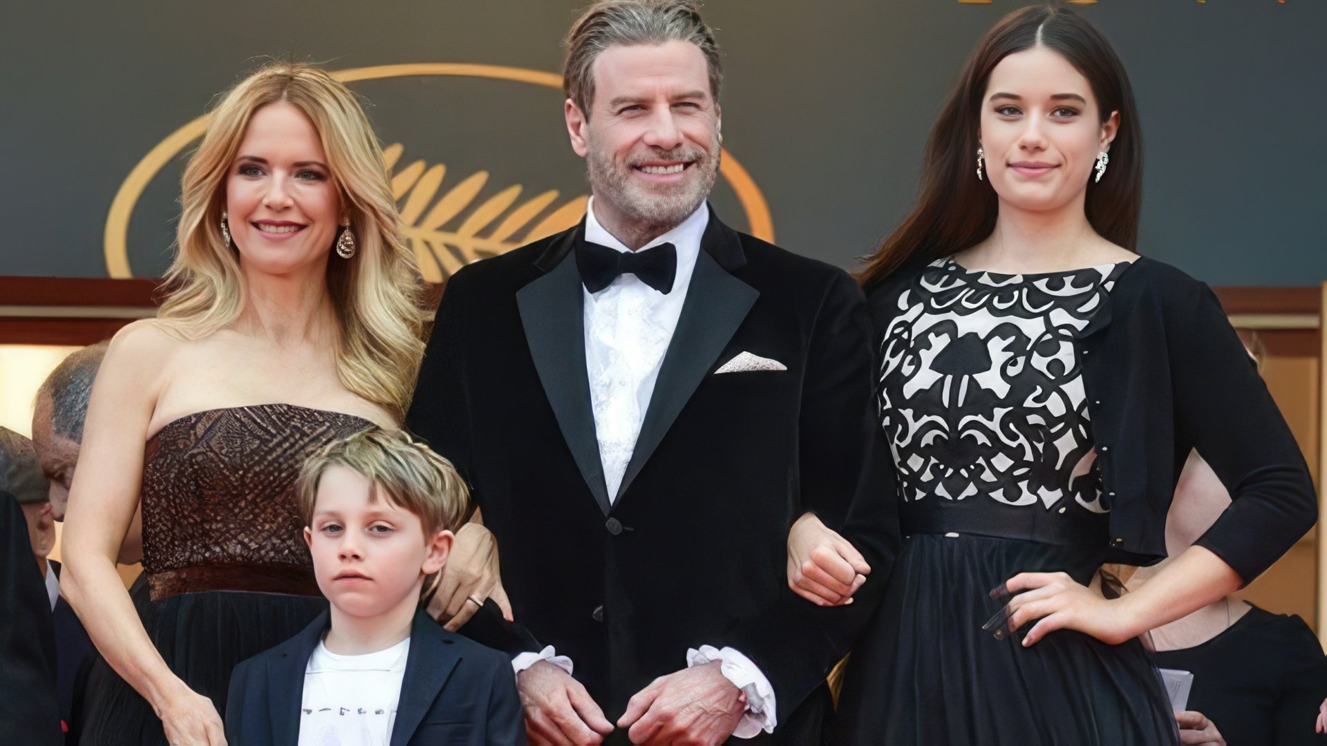 John Travolta, his wife, daughter and son