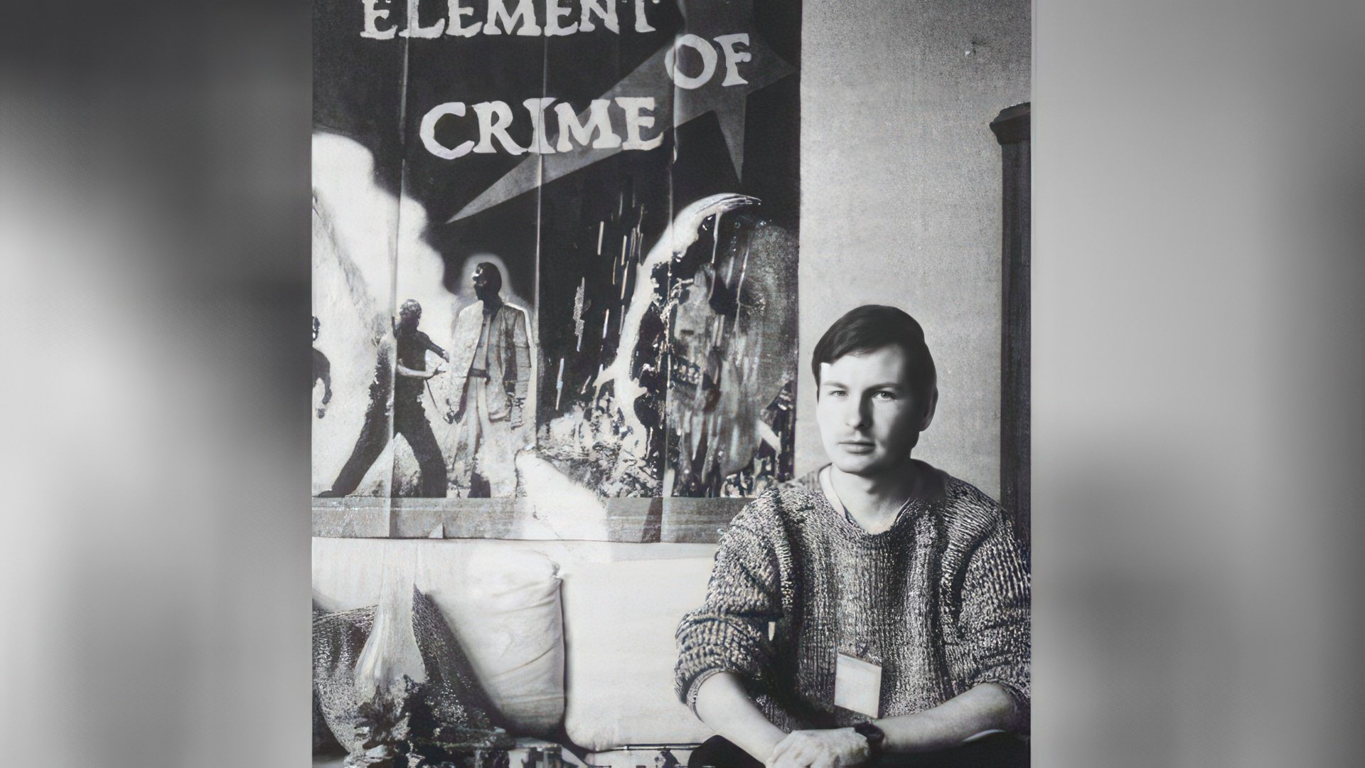 Film Director Against the Background of His Film Poster