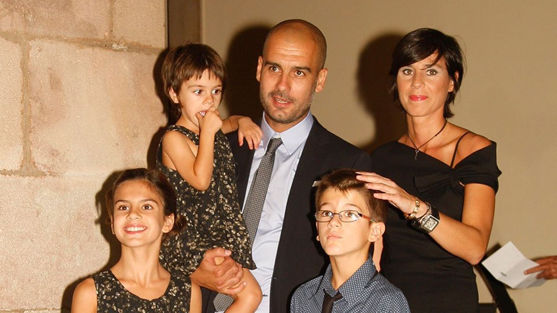 Pep Guardiola with his wife and children