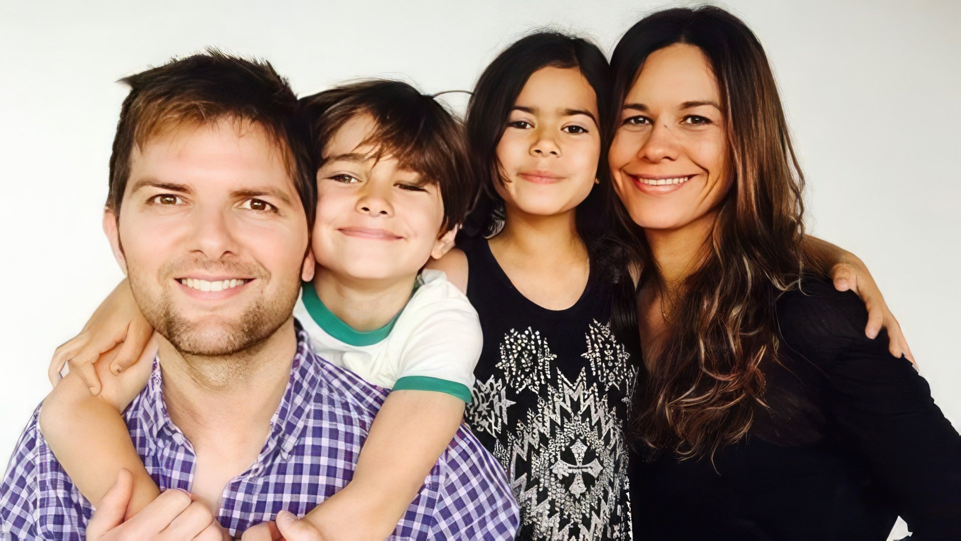 Adam Scott, his wife, and children