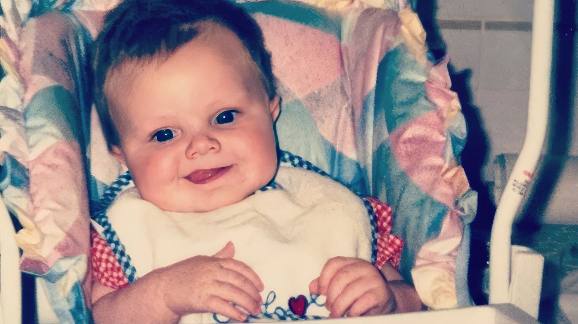 Jack Quaid as a baby