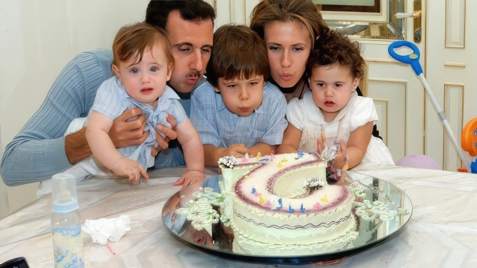 Bashar Al-Assad with his wife and children