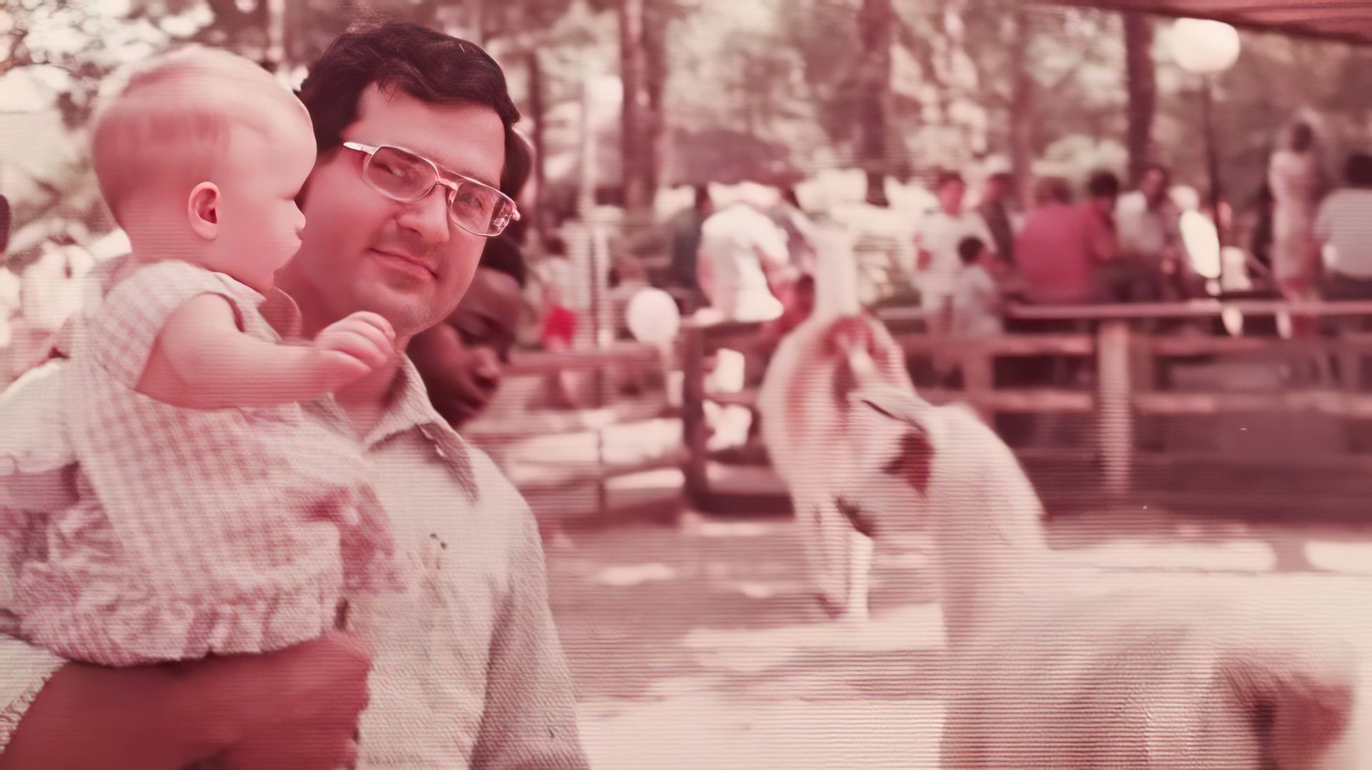 A picture of baby Shannon with her father