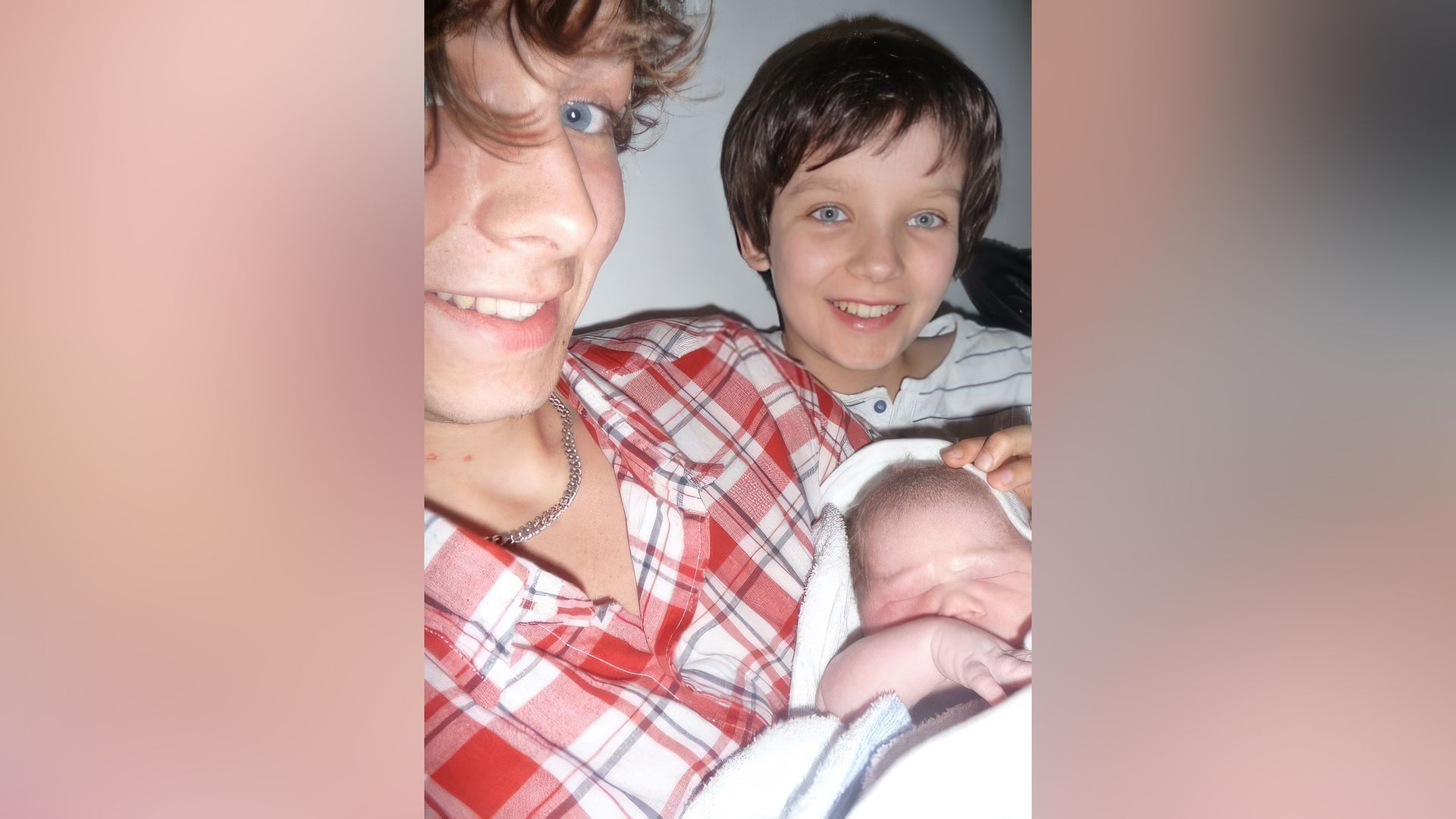 Asa Butterfield with his elder brother and newborn sister
