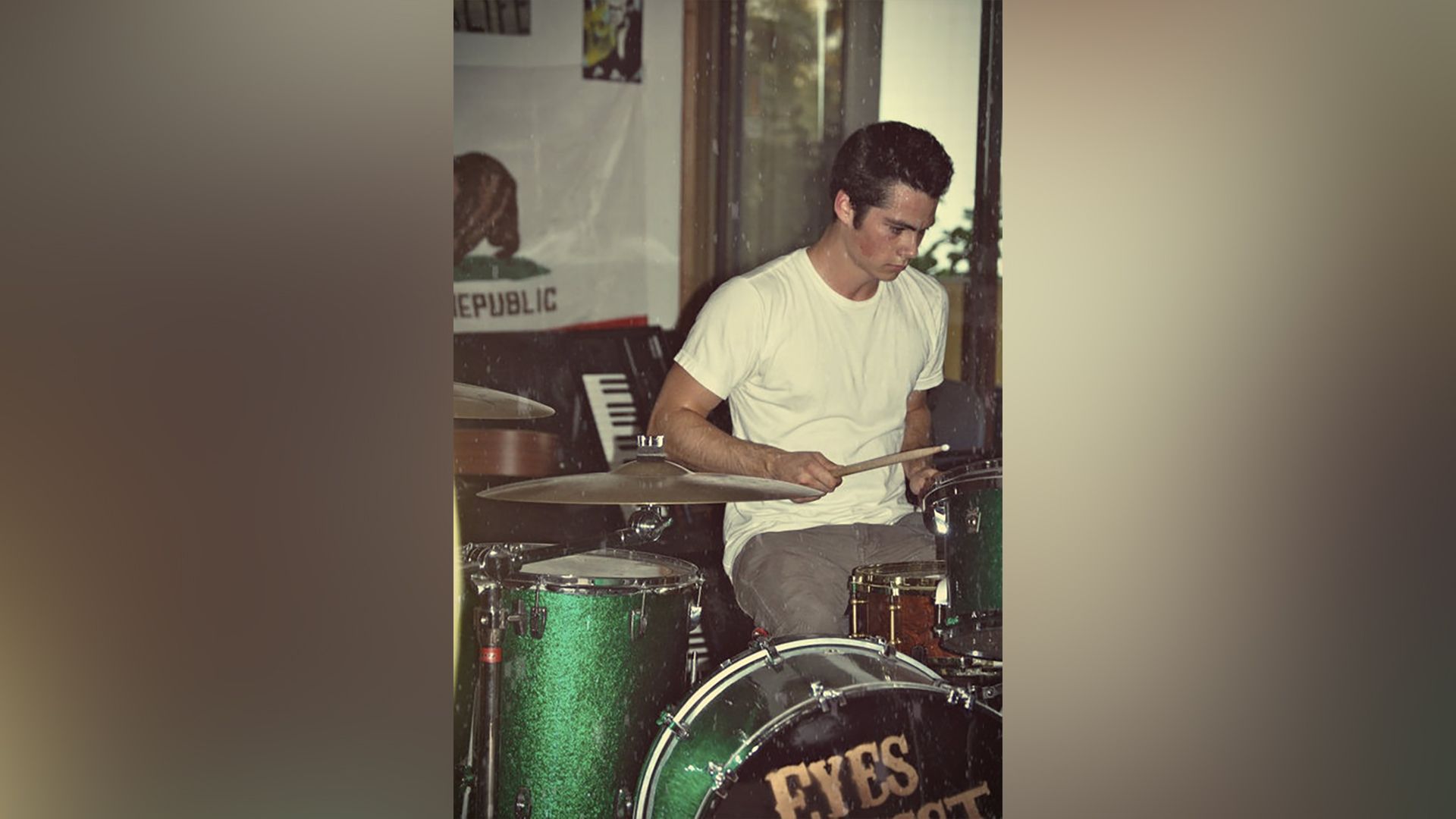 Dylan O’Brien plays drums