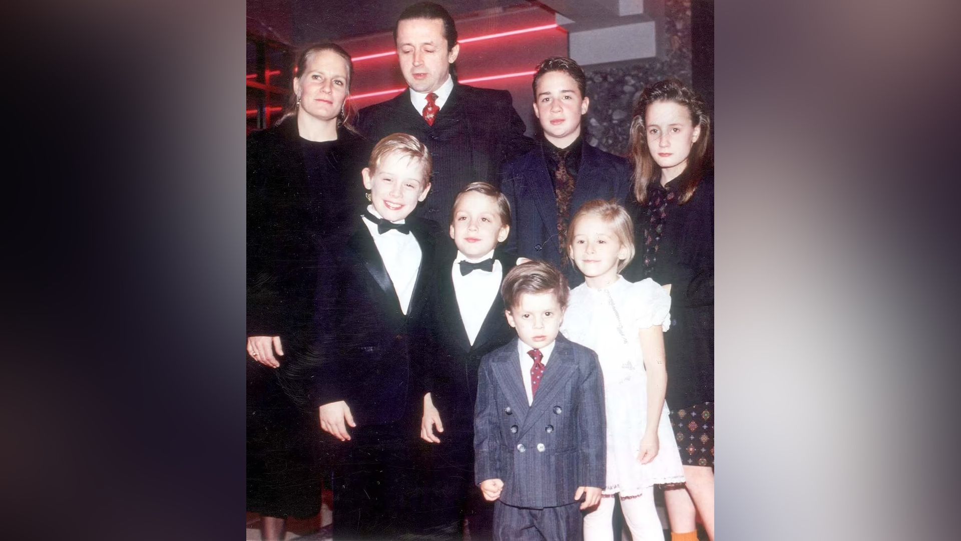 Macaulay Culkin with his parents, brothers and sisters