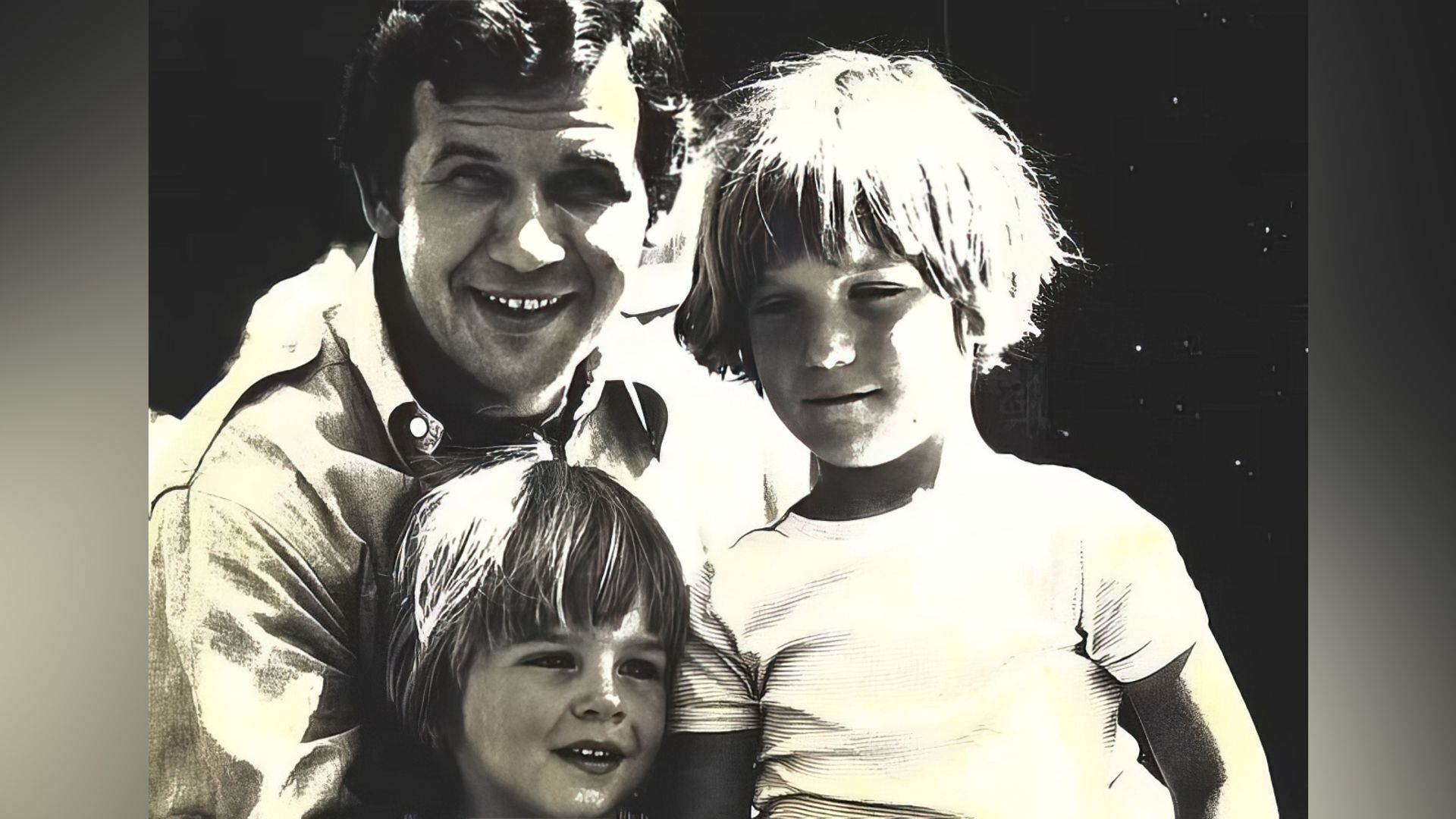 Tucker Carlson with his father and brother