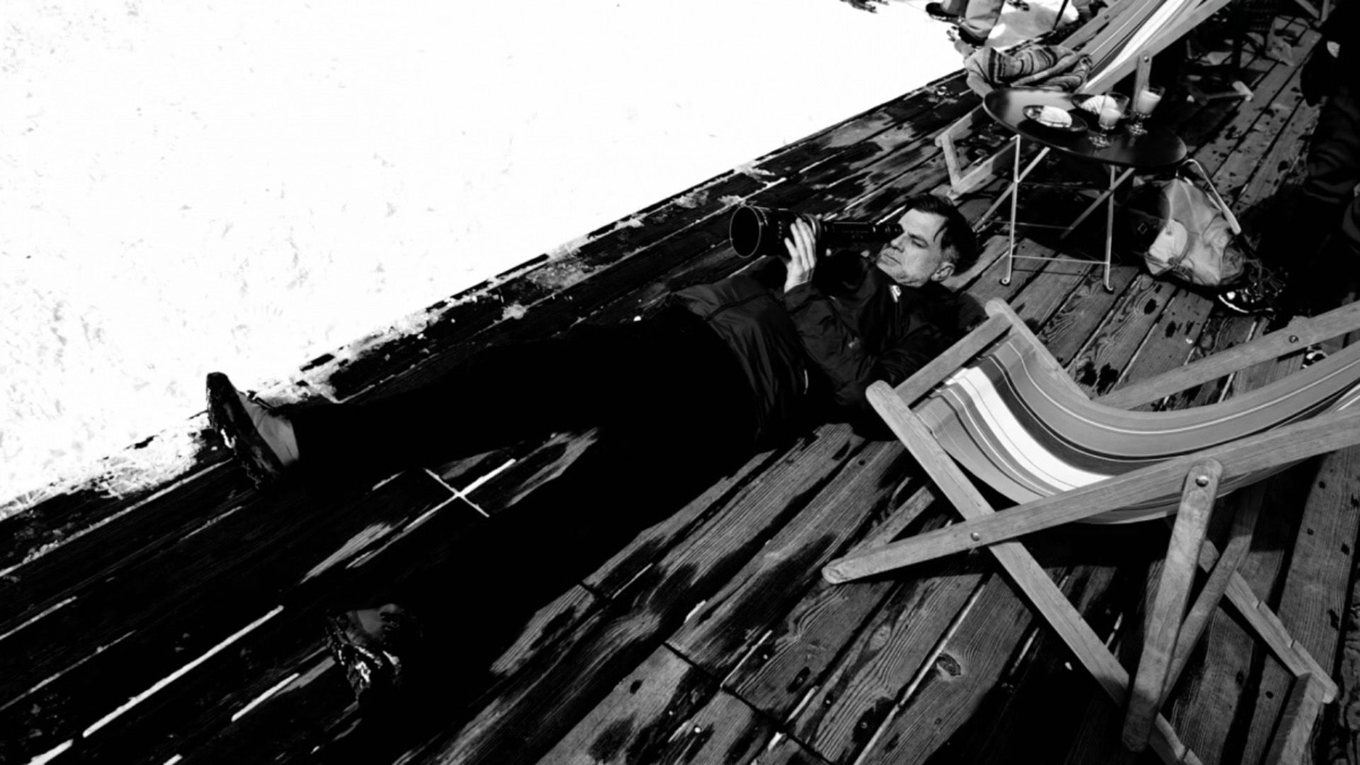 Paul Thomas Anderson lying on the floor looking into the camera lens