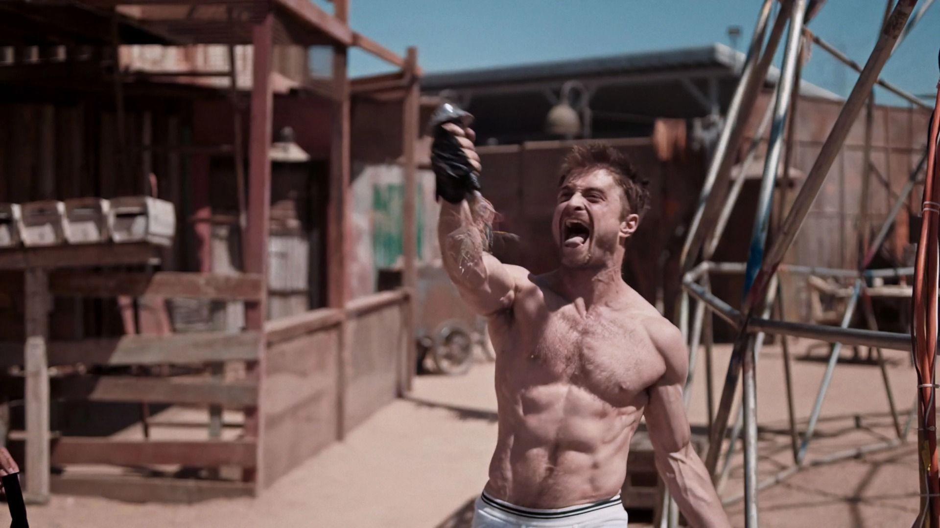 Daniel Radcliffe screaming while flexing his muscles
