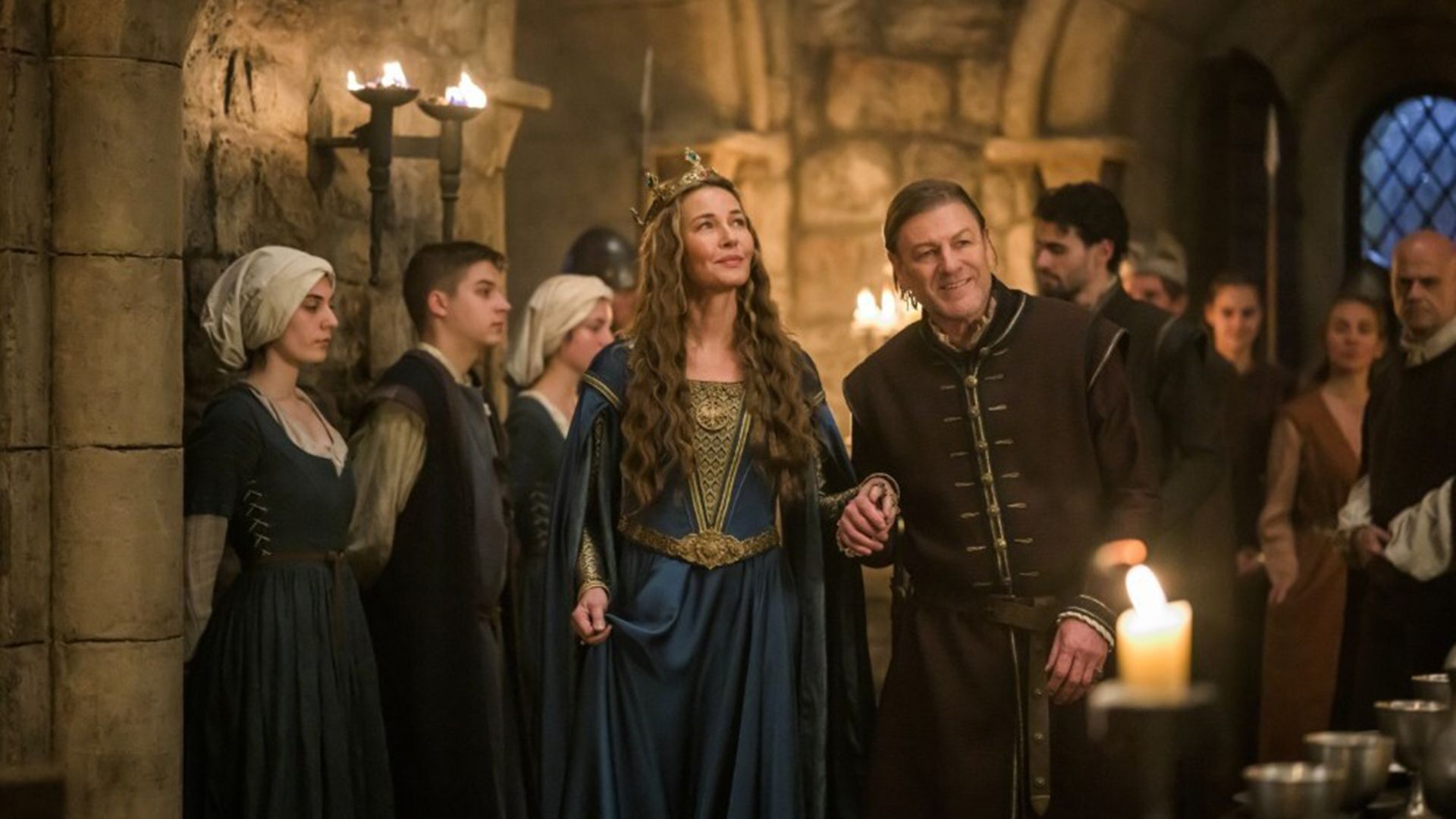 Connie Nielsen and Sean Bean in period costumes inside a castle