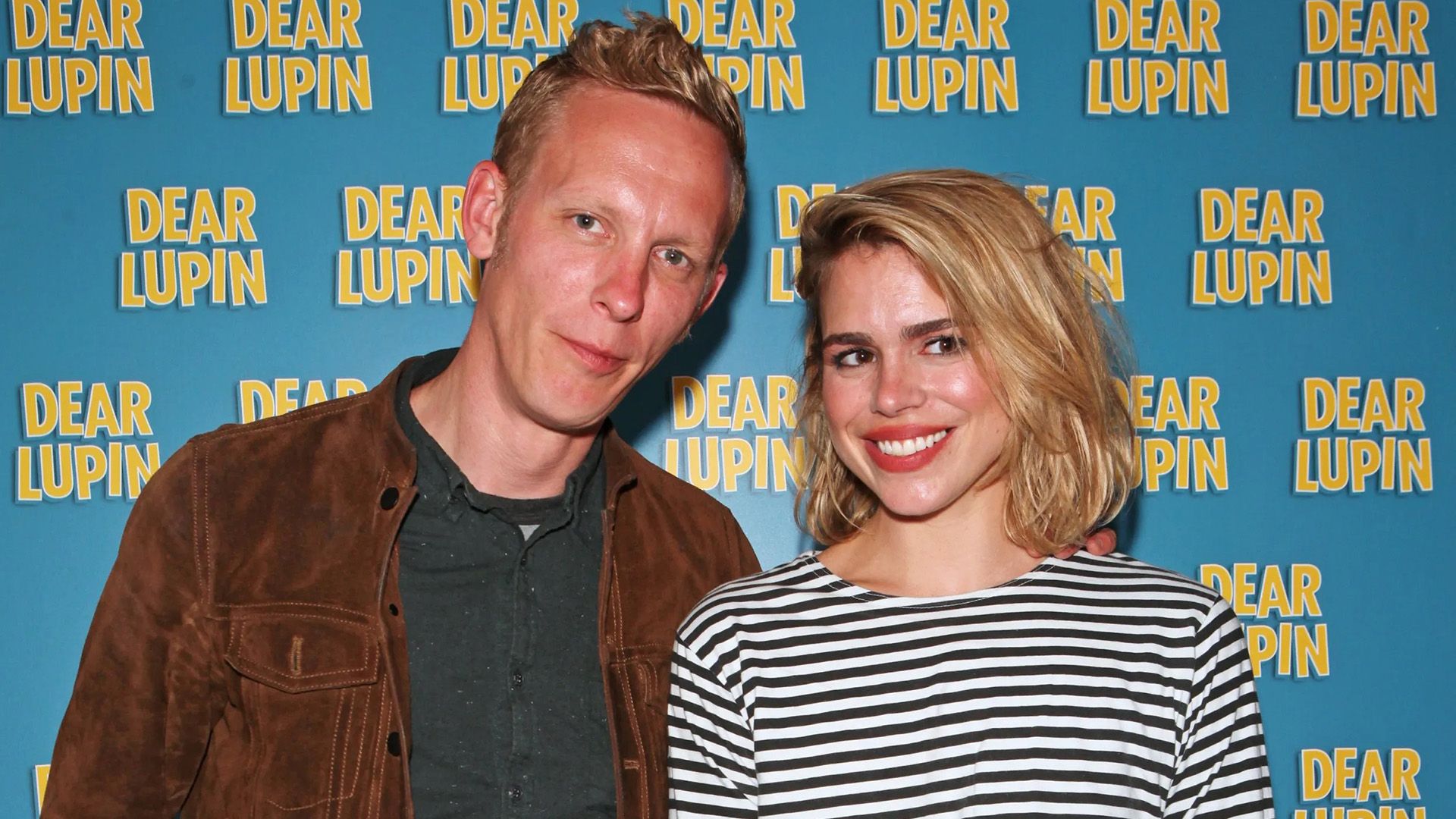 Billie Piper in a striped sweater and Laurence Fox in a brown jacket against a blue background