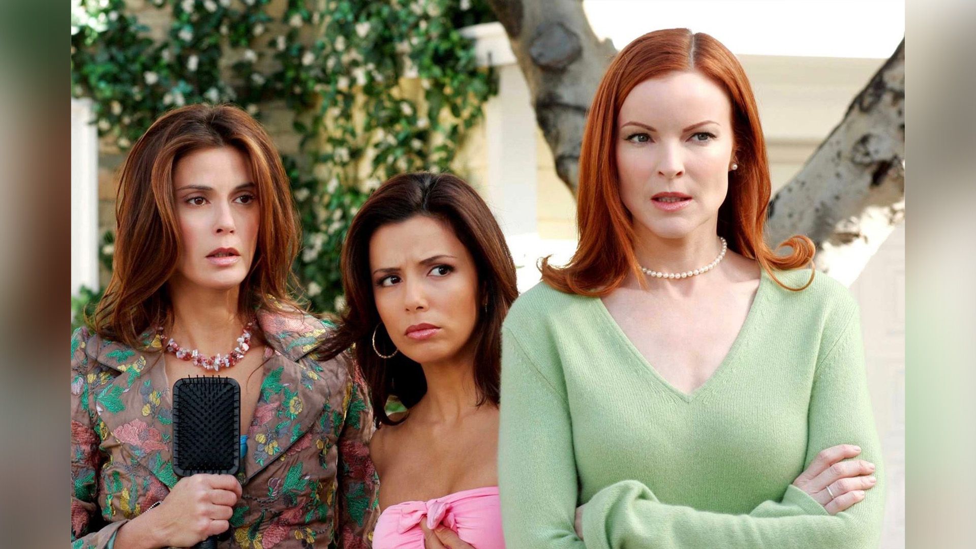 Teri Hatcher, Eva Longoria, and Marcia Cross stand frowning, their eyes warily fixed ahead