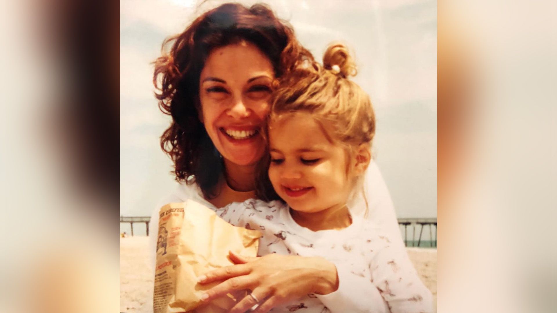 Young Teri Hatcher hugs her little daughter Emerson and beams with joy