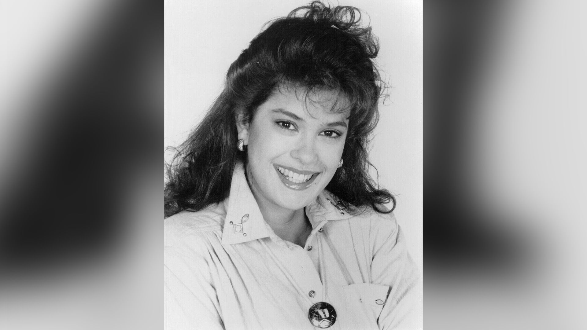 Young Teri Hatcher in a light shirt