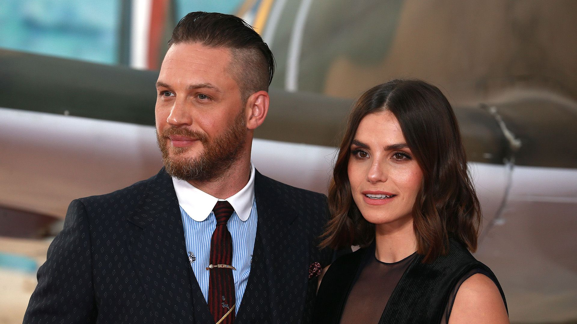 Charlotte Riley and Tom Hardy pose at a social event