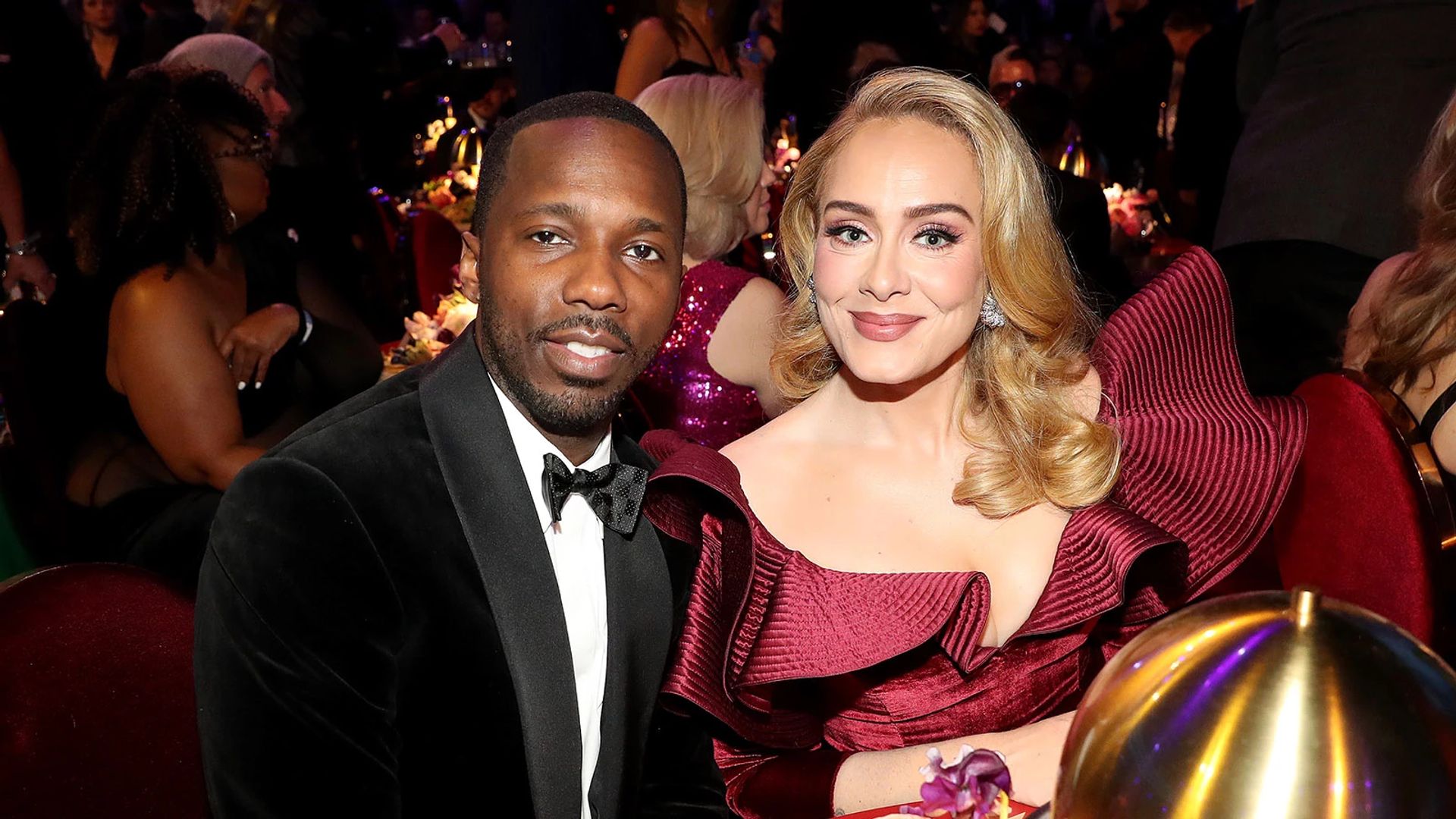 Adele and Rich Paul pose for the camera in evening attire at a social event