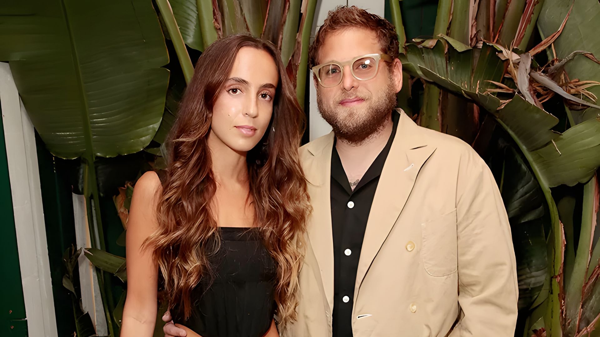 Jonah Hill and Gianna Santos pose together on the red carpet