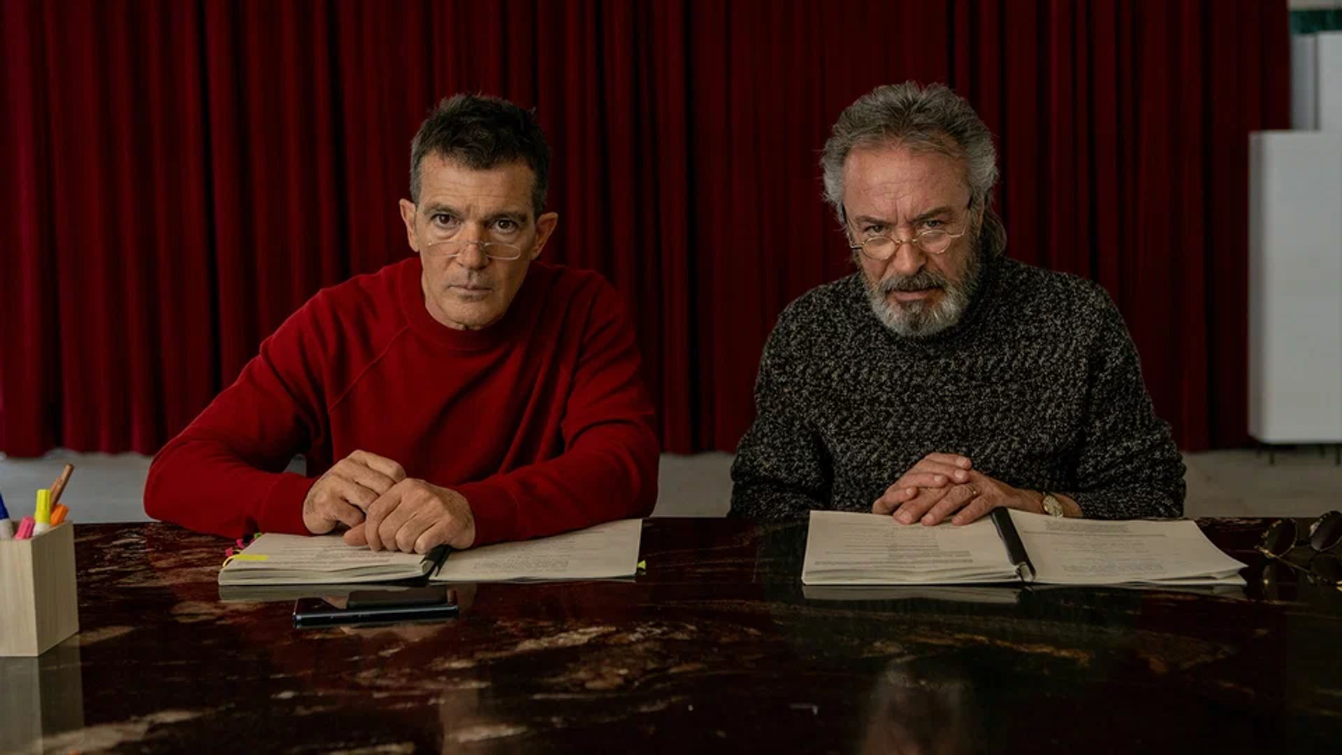 Antonio Banderas and Oscar Martínez staring intently at the camera