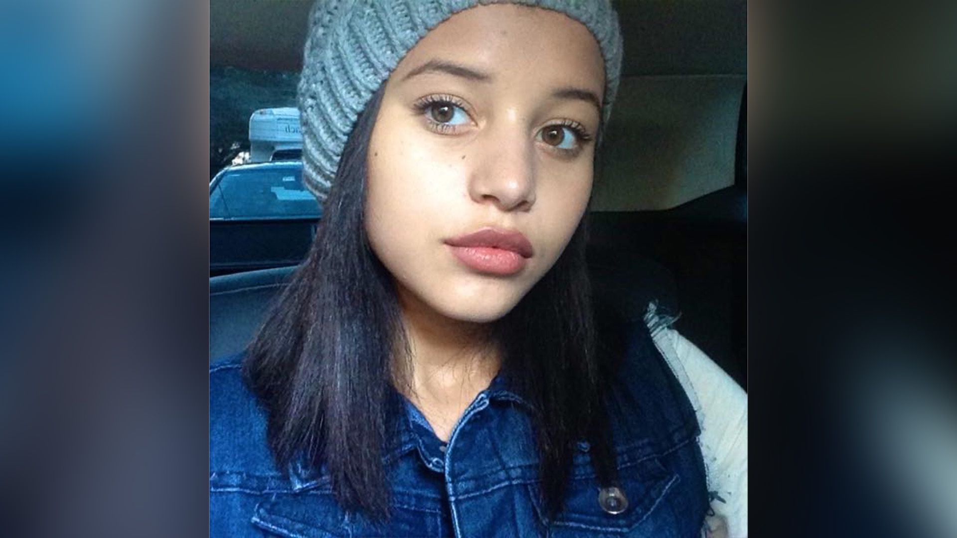 Chase Infiniti as a child wearing a gray knit hat