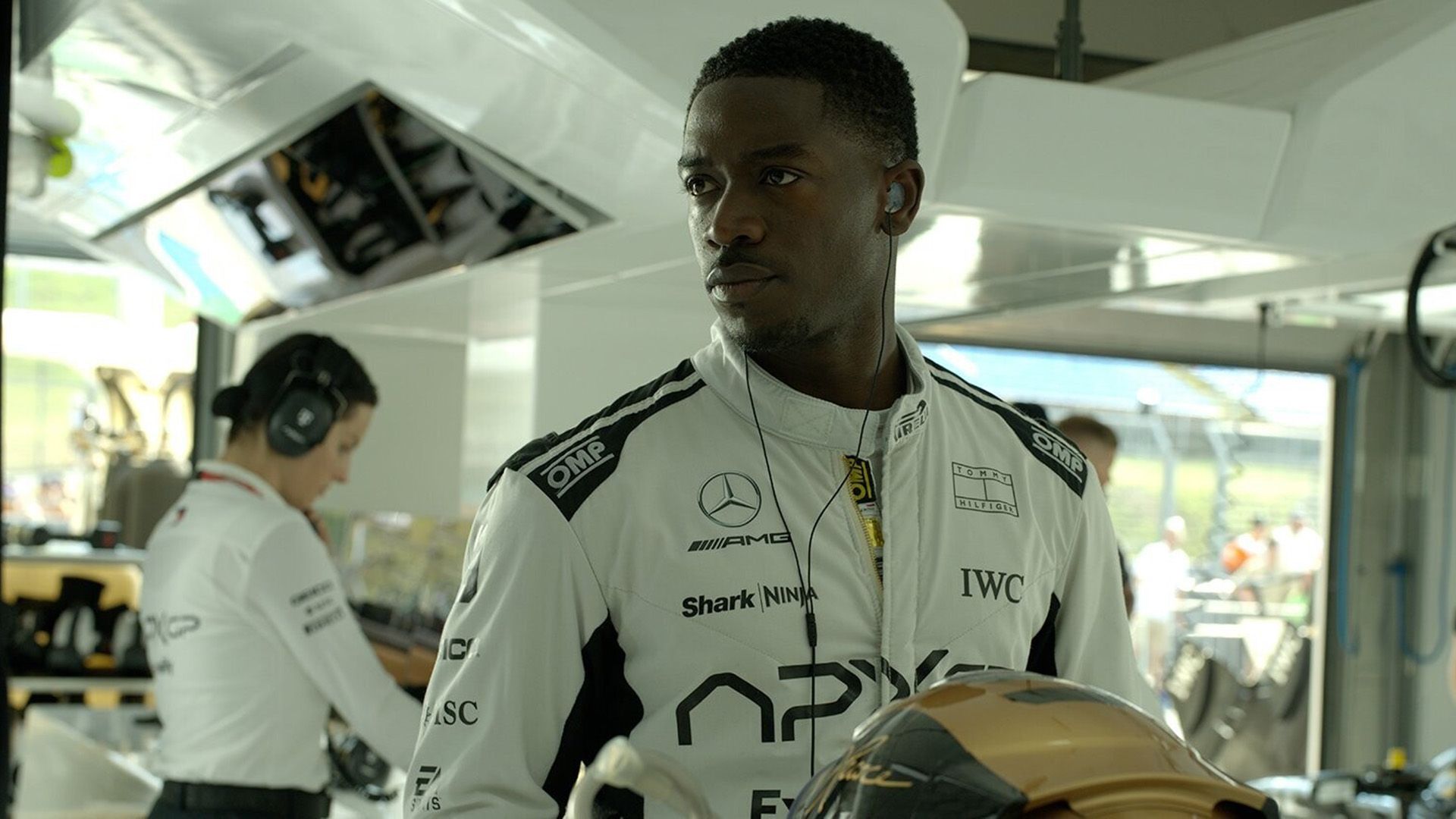 Damson Idris in a white racing suit