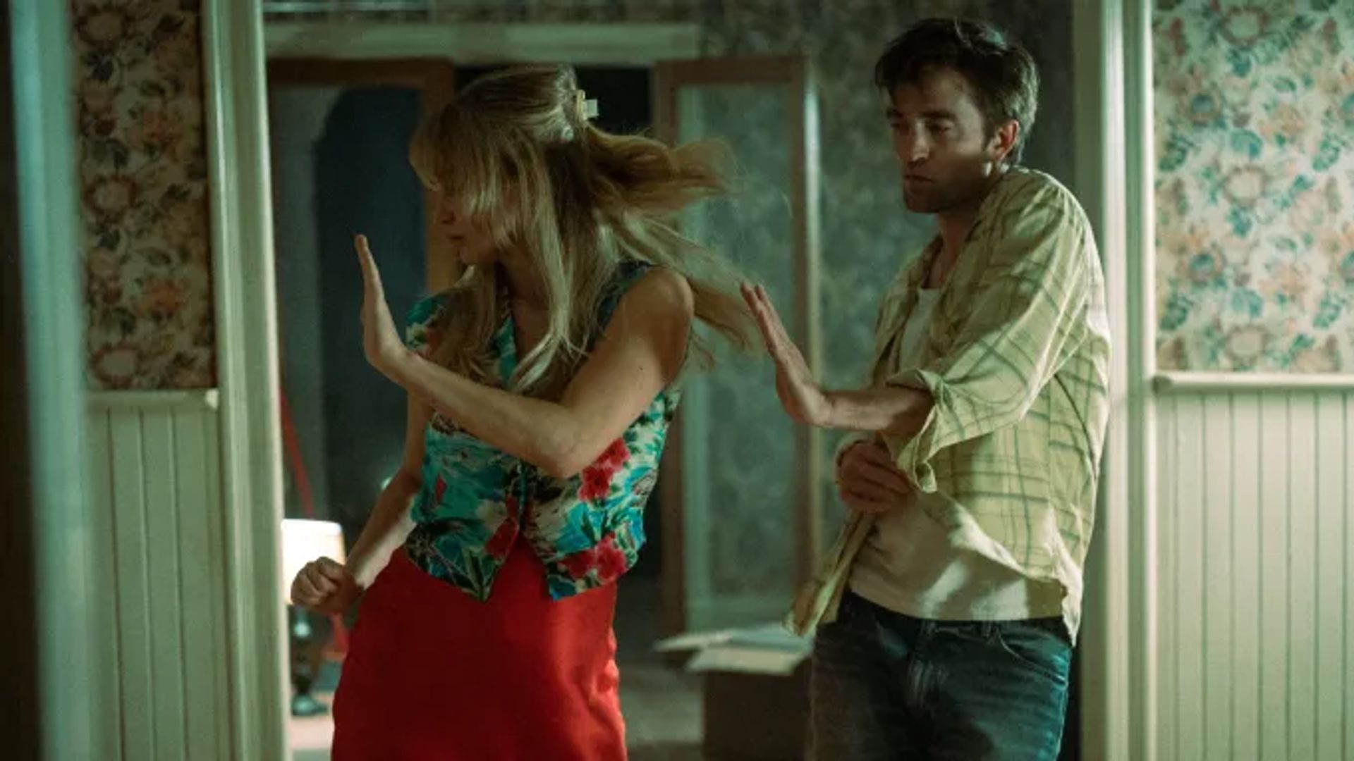 Jennifer Lawrence and Robert Pattinson dancing at home