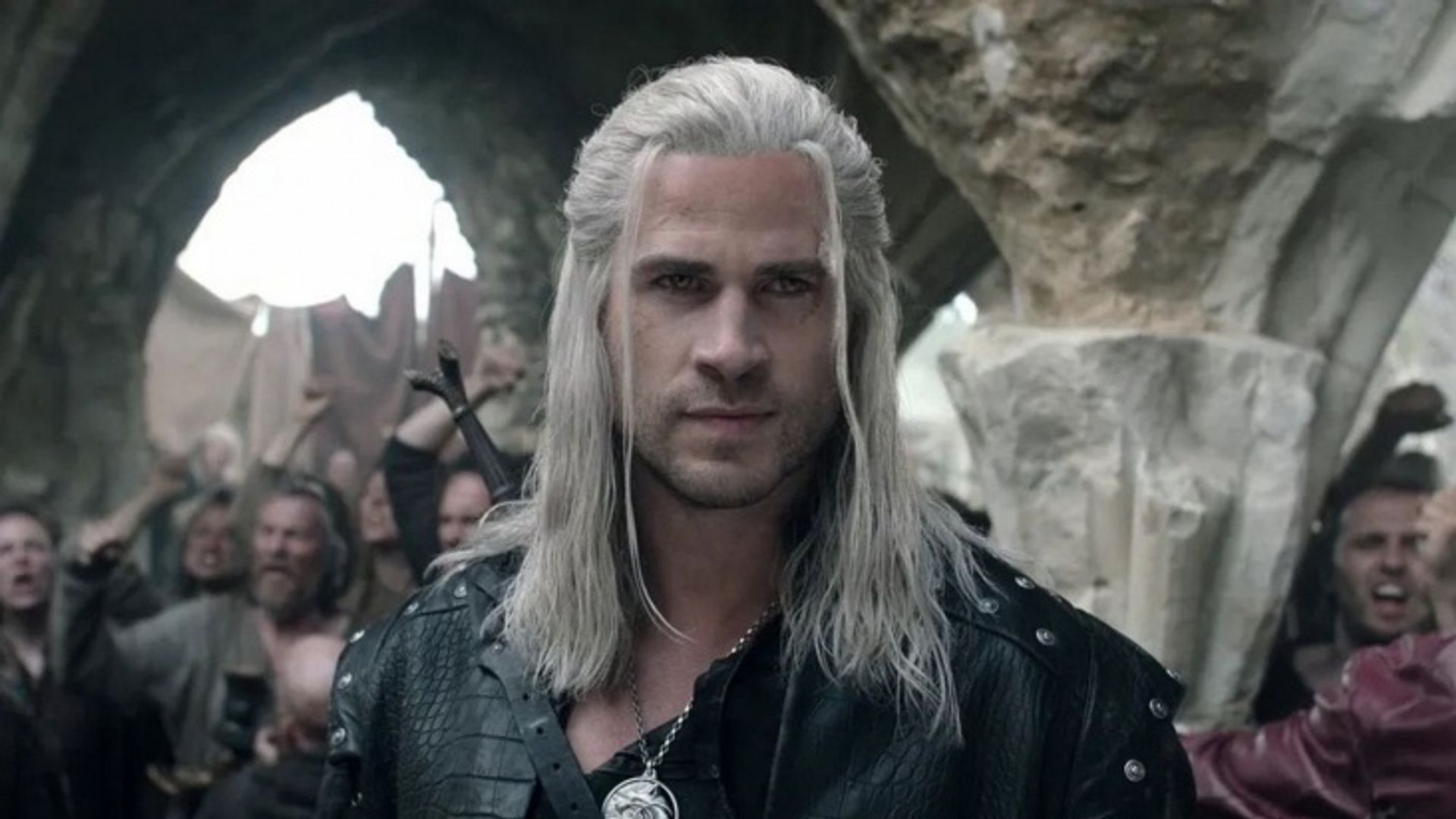 Liam Hemsworth in Witcher makeup: long white hair, leather jacket