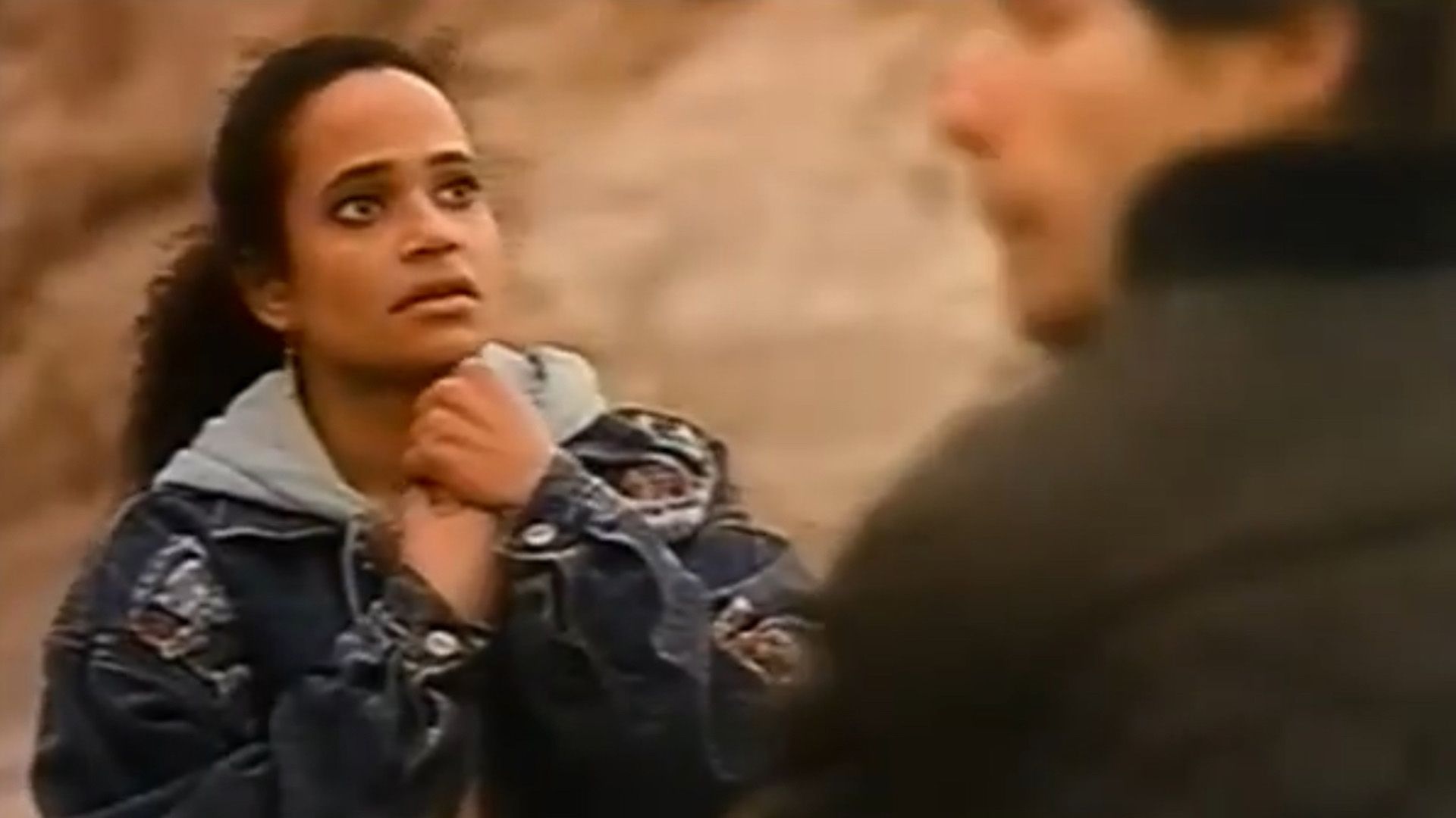 Young Judy Reyes with a frightened look
