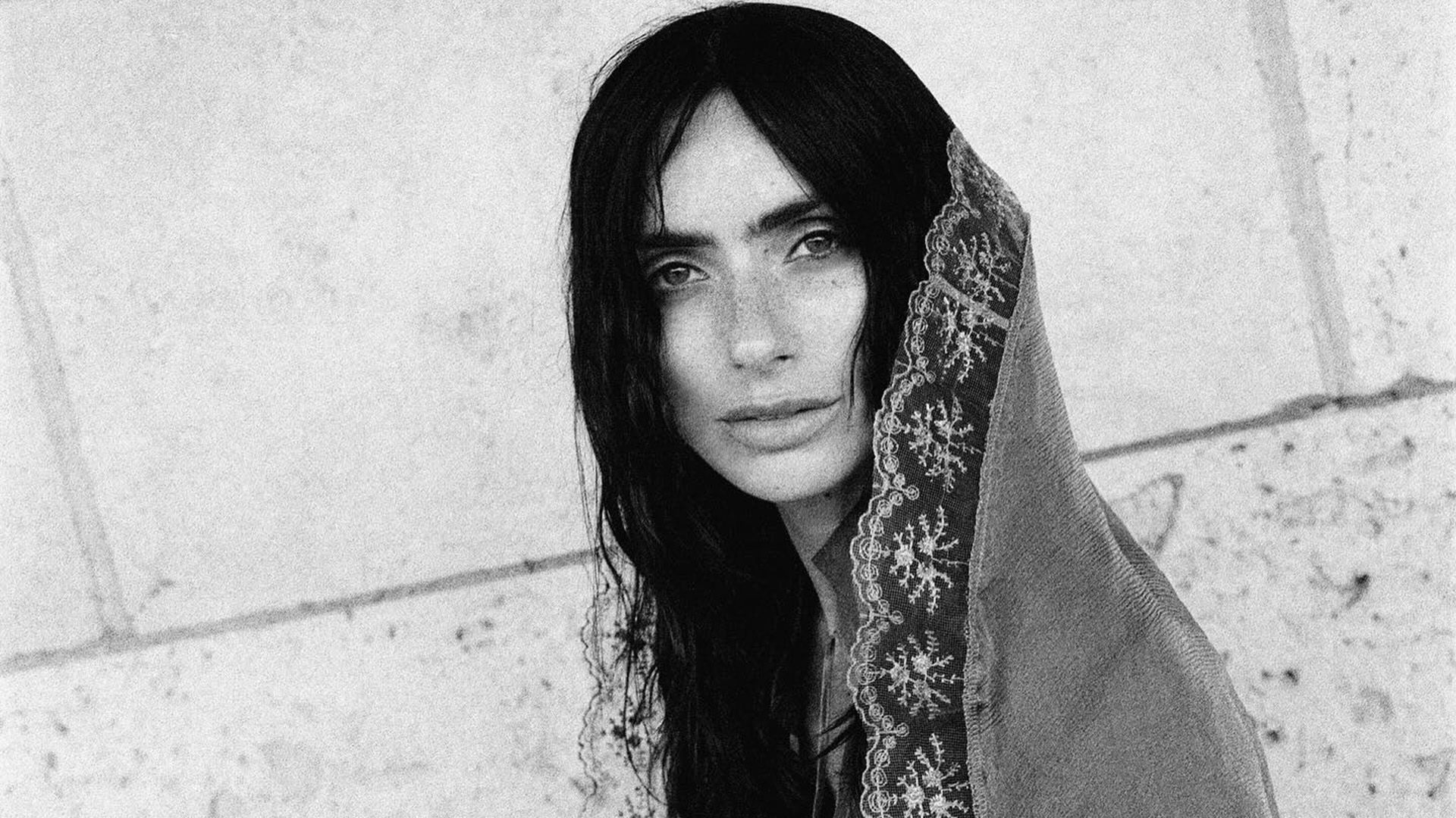 Zoe Bleu with her hair down, covered by a lace scarf