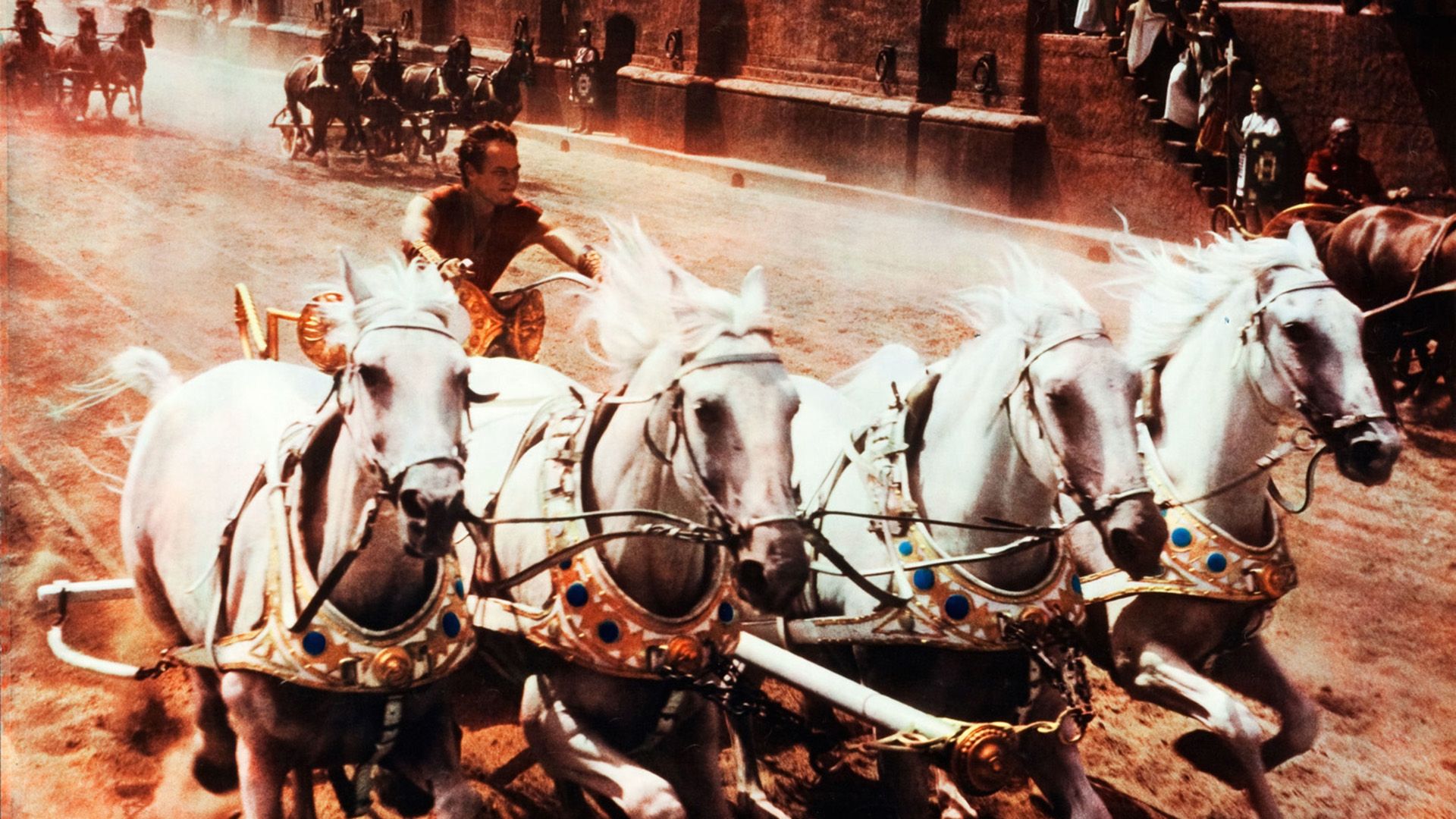 Ancient Rome, a man rushes in a chariot drawn by a team of four white horses