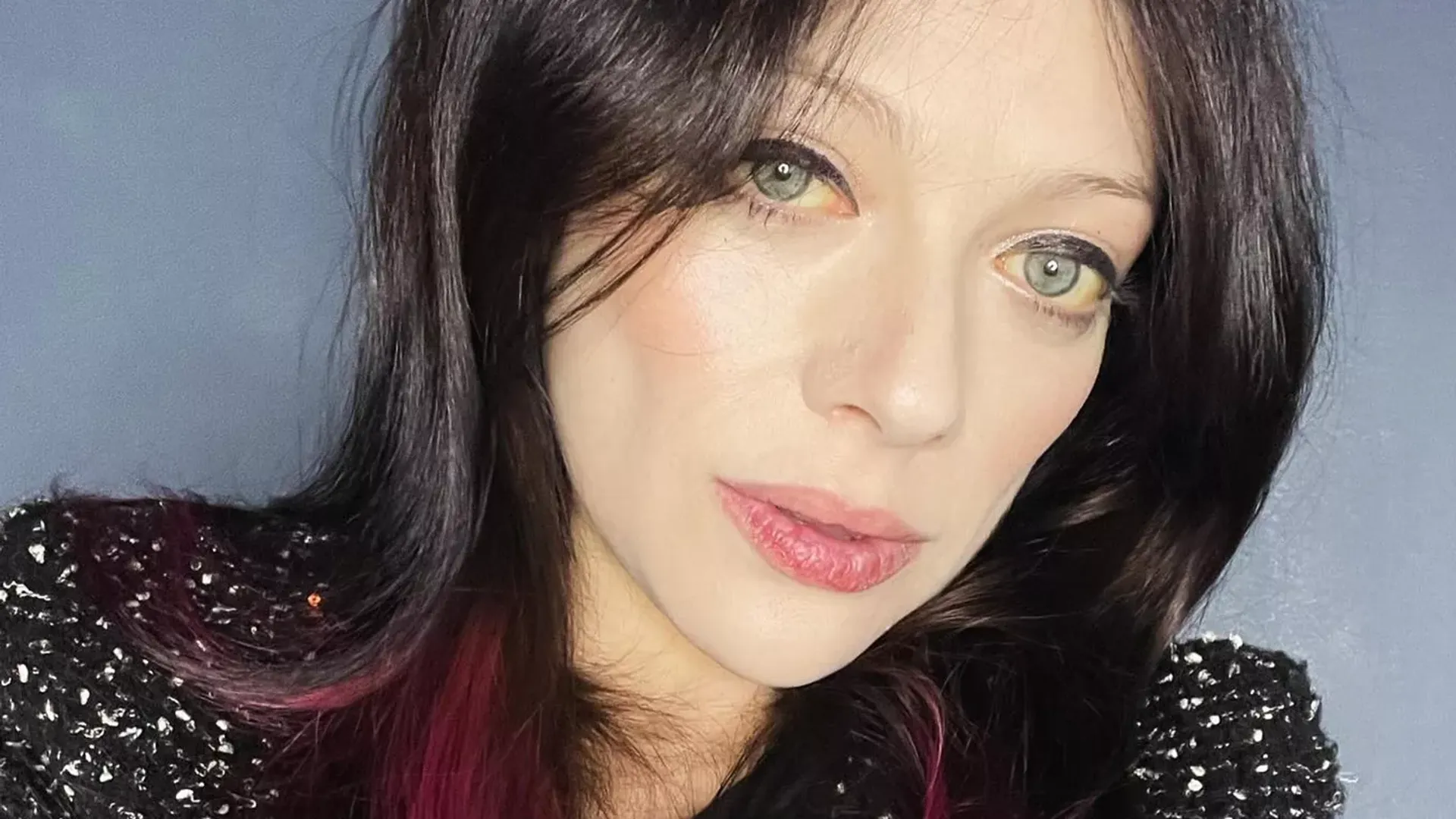 A selfie of actress Michelle Trachtenberg, the whites of her eyes have a yellowish tint