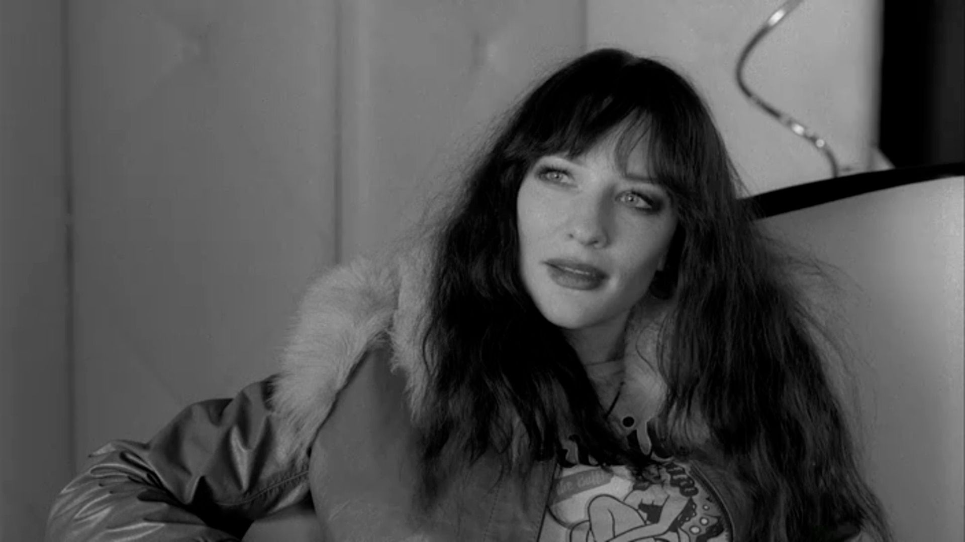 Cate Blanchett with long black hair in a scene from the movie "Coffee and Cigarettes"